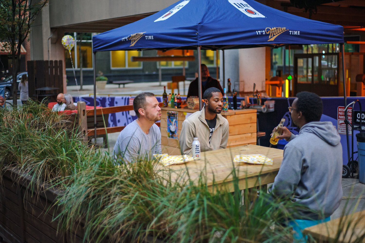 Friends relax at the Porch Off Calhoun.