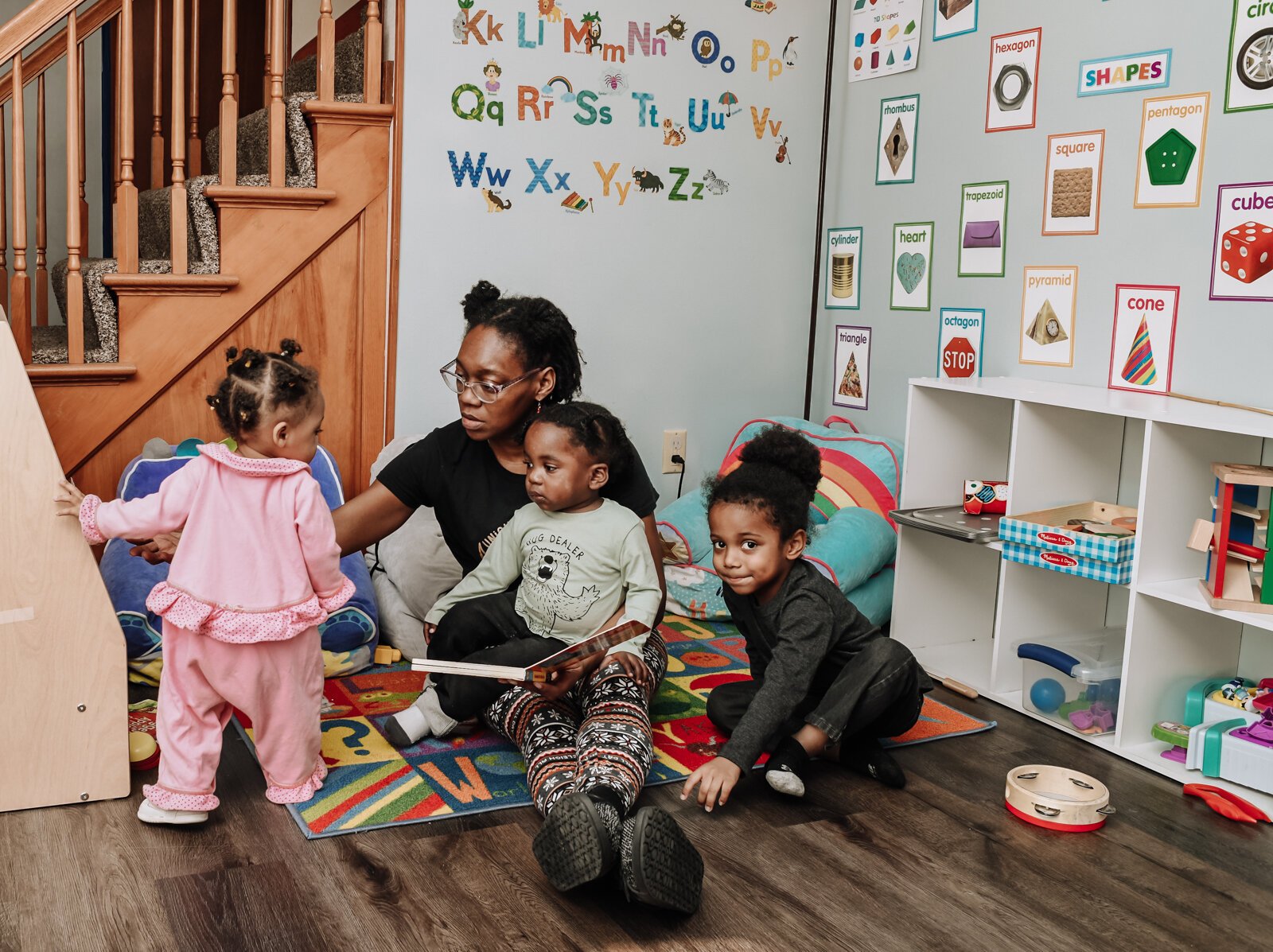 Deondra Steward, Owner of Unique Cherubs, takes care of children from left, Jaliyah, JereMias, and Domonique.