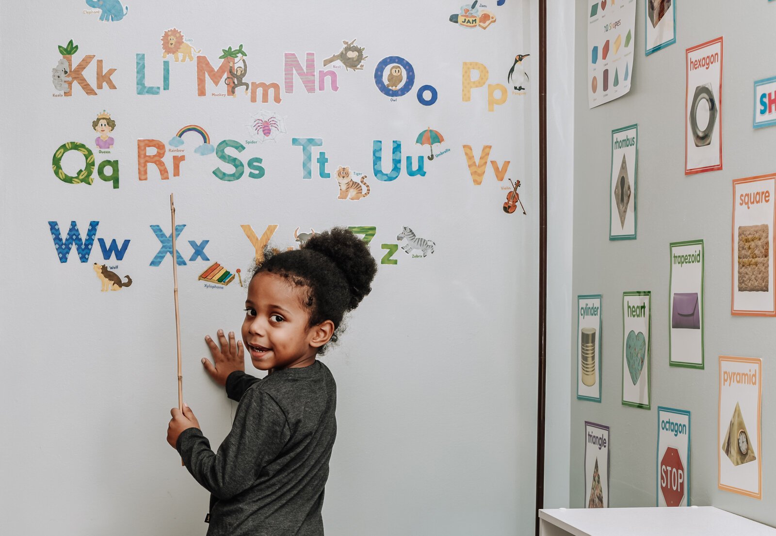 Domonique participates in a learning activity during Deondra Steward's home-based daycare service Unique Cherubs.