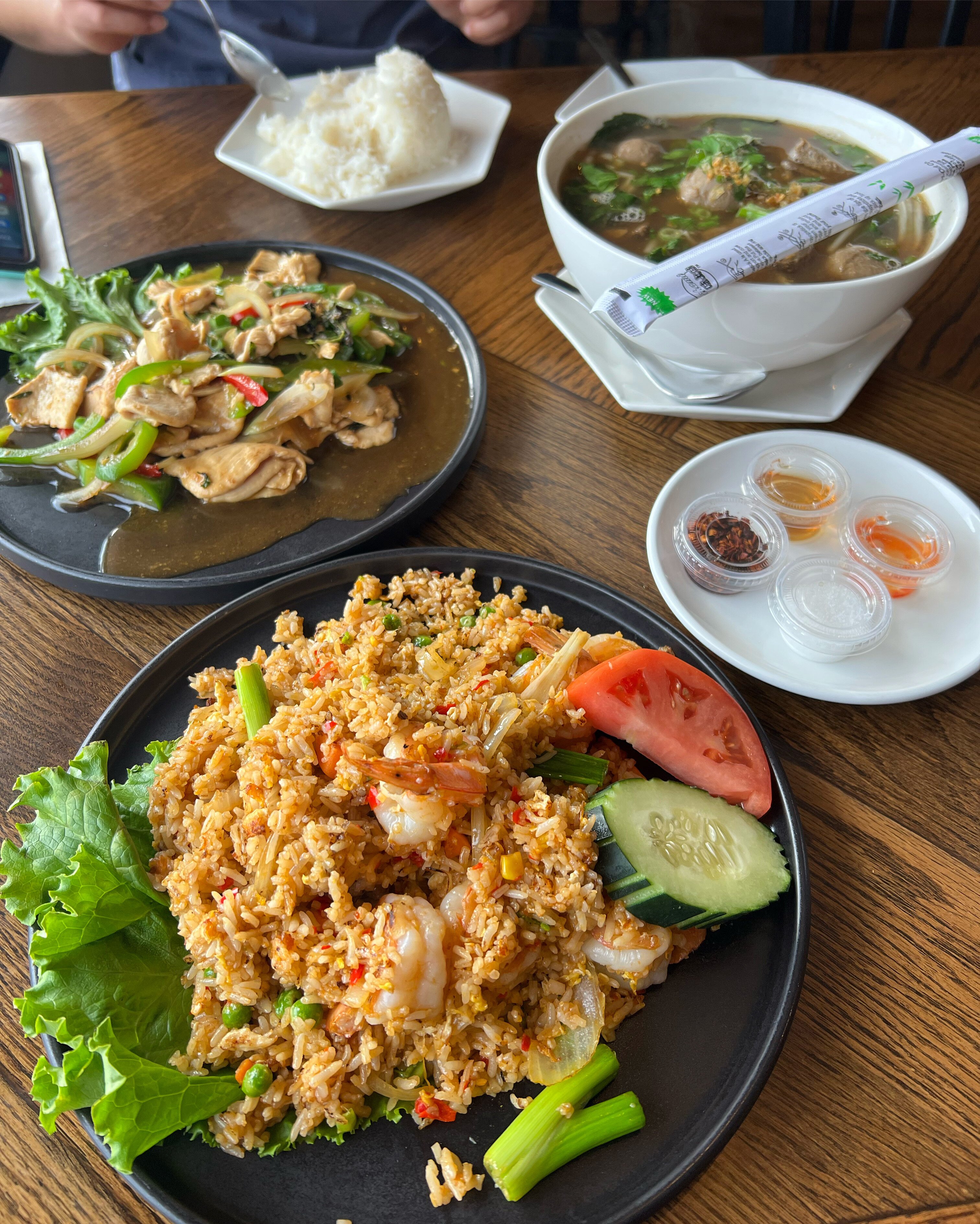 Shrimp Tomalley Fried Rice, Wall Street Basil Stir-Fry, and Noodle Soup from Bangkok Bistro.