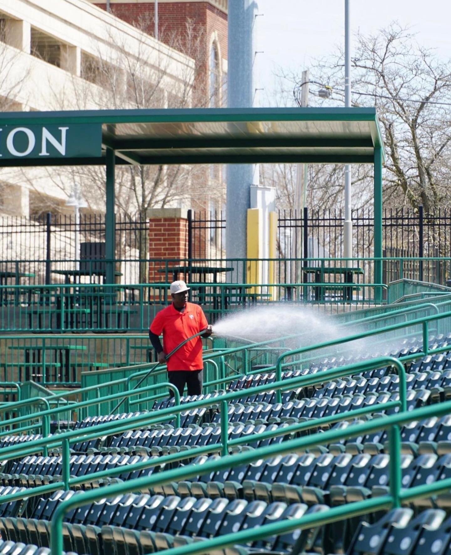 Parkview Field employees prepare the ballpark for opening day.