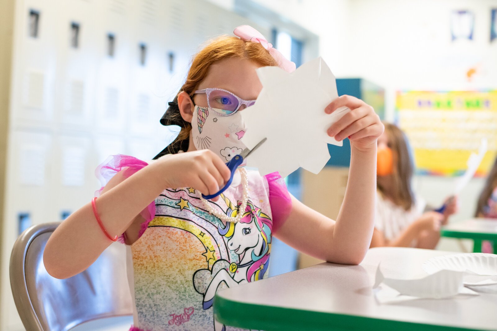 Kaylee works on a sunflower art project in Room A during the Y Care Program at the Parkview Family YMCA, 10001 Dawson's Creek.