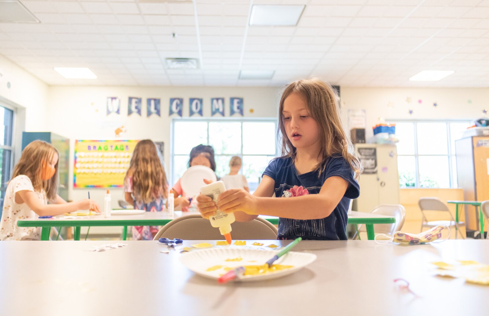 Lucy works on a sunflower art project in Room A during the Y Care Program at the Parkview Family YMCA, 10001 Dawson's Creek.