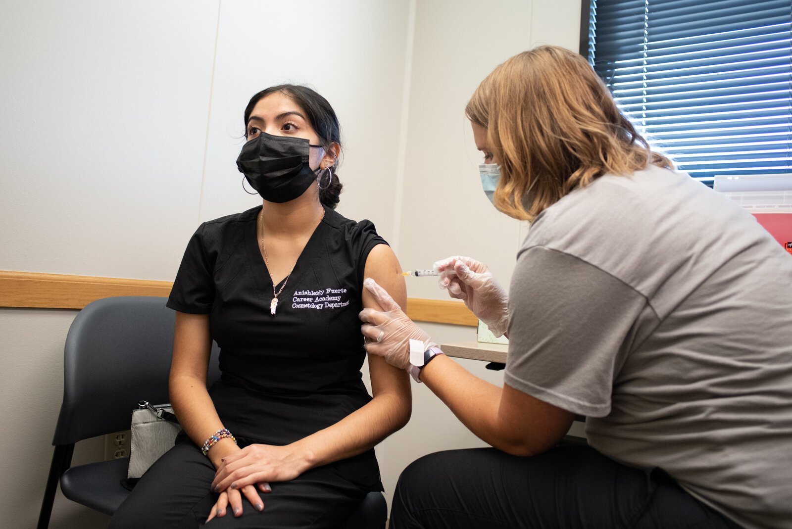 Anishleidy gets a school vaccination from Staci Kaczmarek at Super Shot, 1515 Hobson Road.