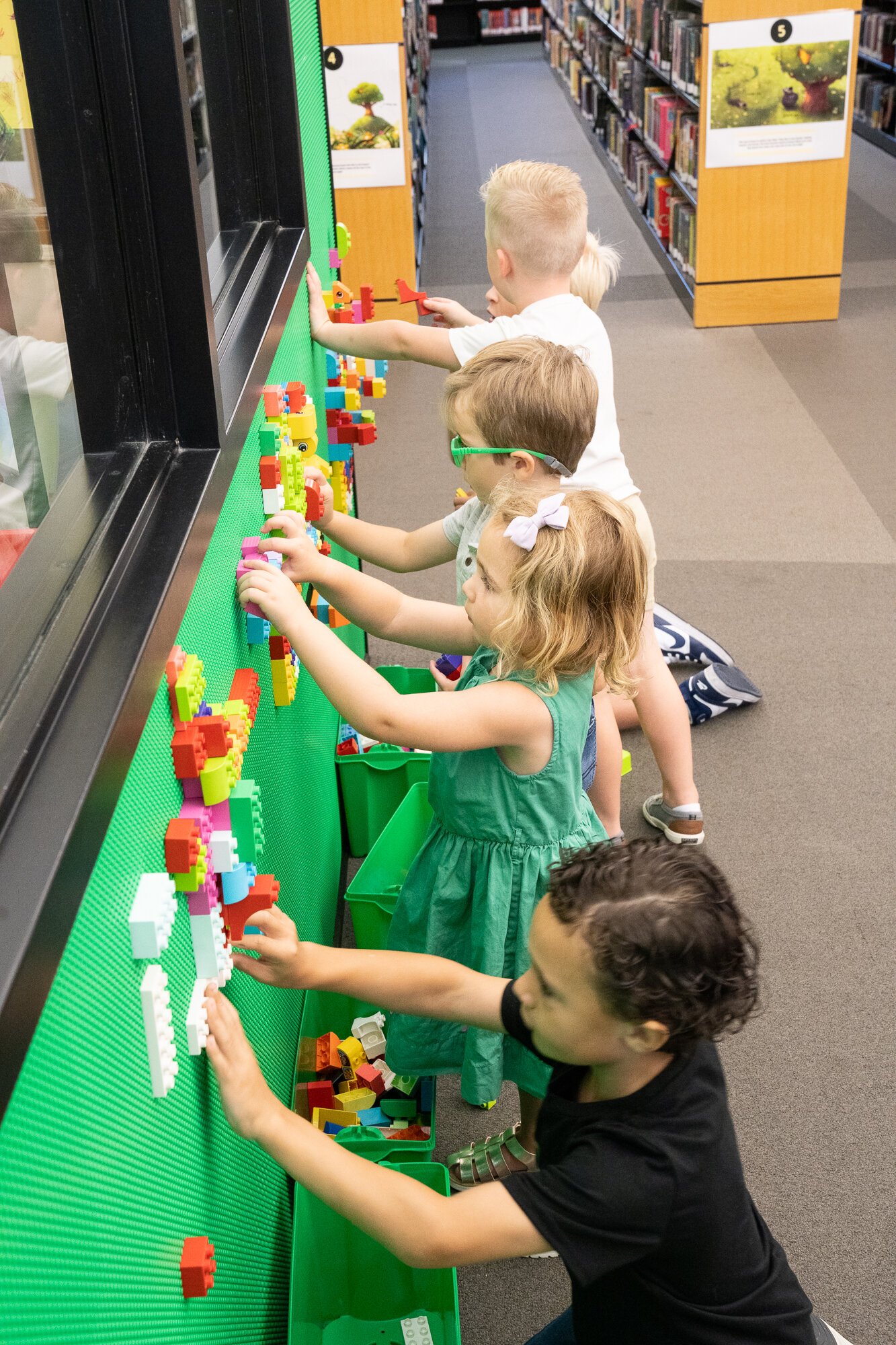 Children play with the Lego wall at ACPL.