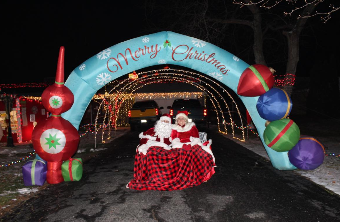 Santa and Mrs. Claus sit in front of Matt and Jody Ellenwood’s home at 721 Pelham Dr.