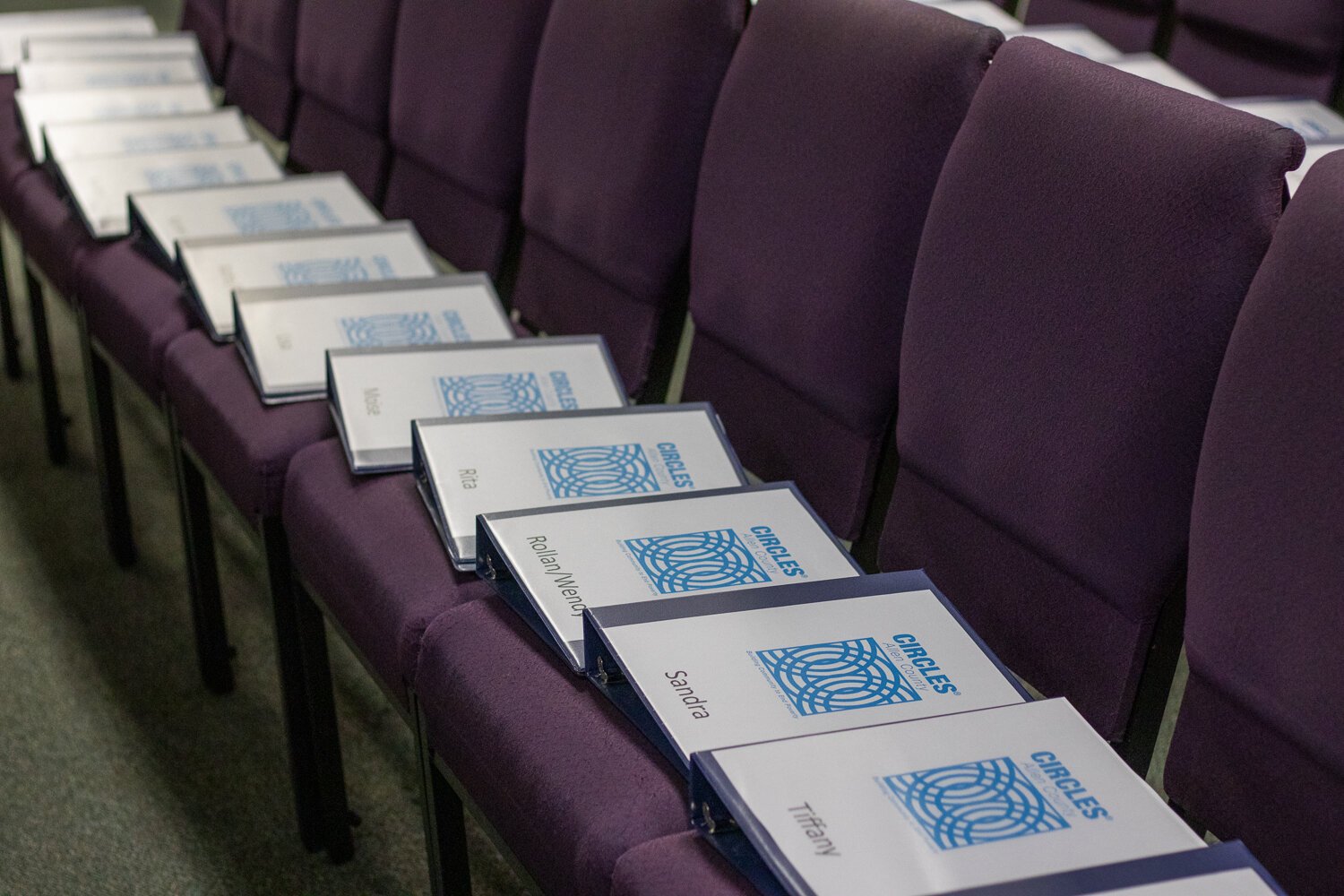 Folders containing a workbook and paperwork for Leaders and Allies at the first meeting for Circles of Allen County.