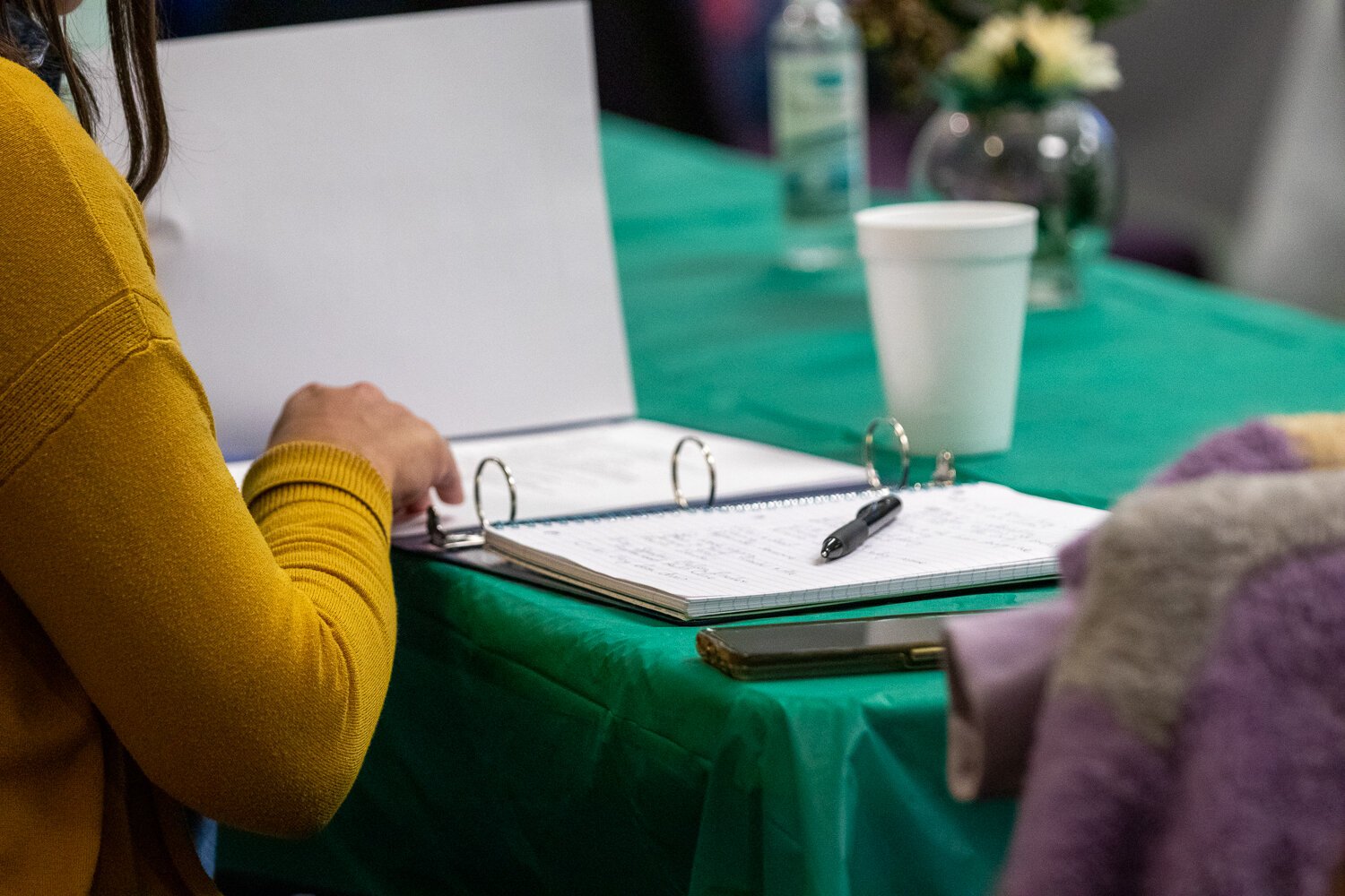 An Ally flips through her workbook at the first meeting of Circles of Allen County.