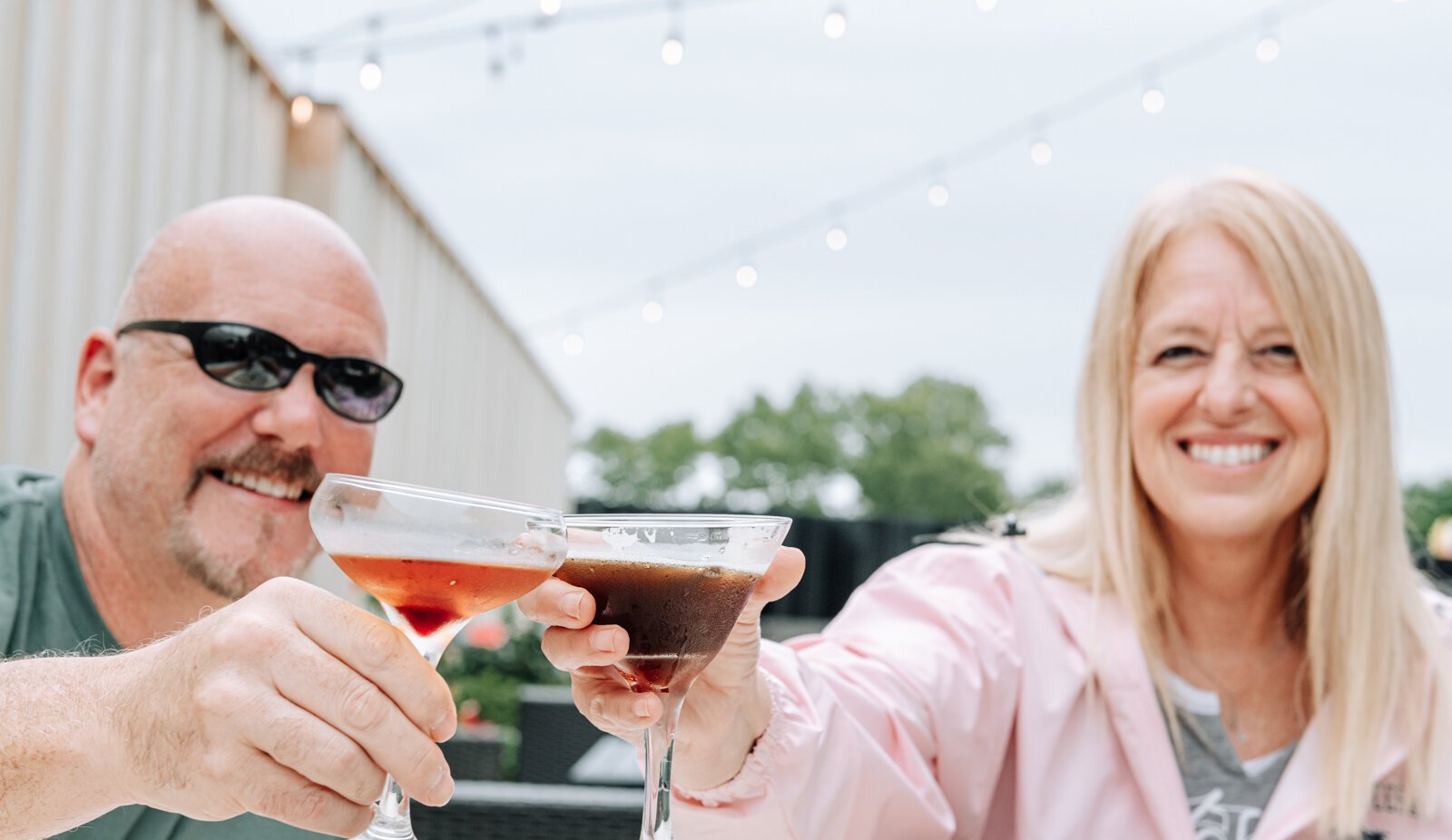 Brian Leslie and Casey Bussell celebrate with an espresso martini and smoked manhattan at Club Soda, 235 E. Superior St.