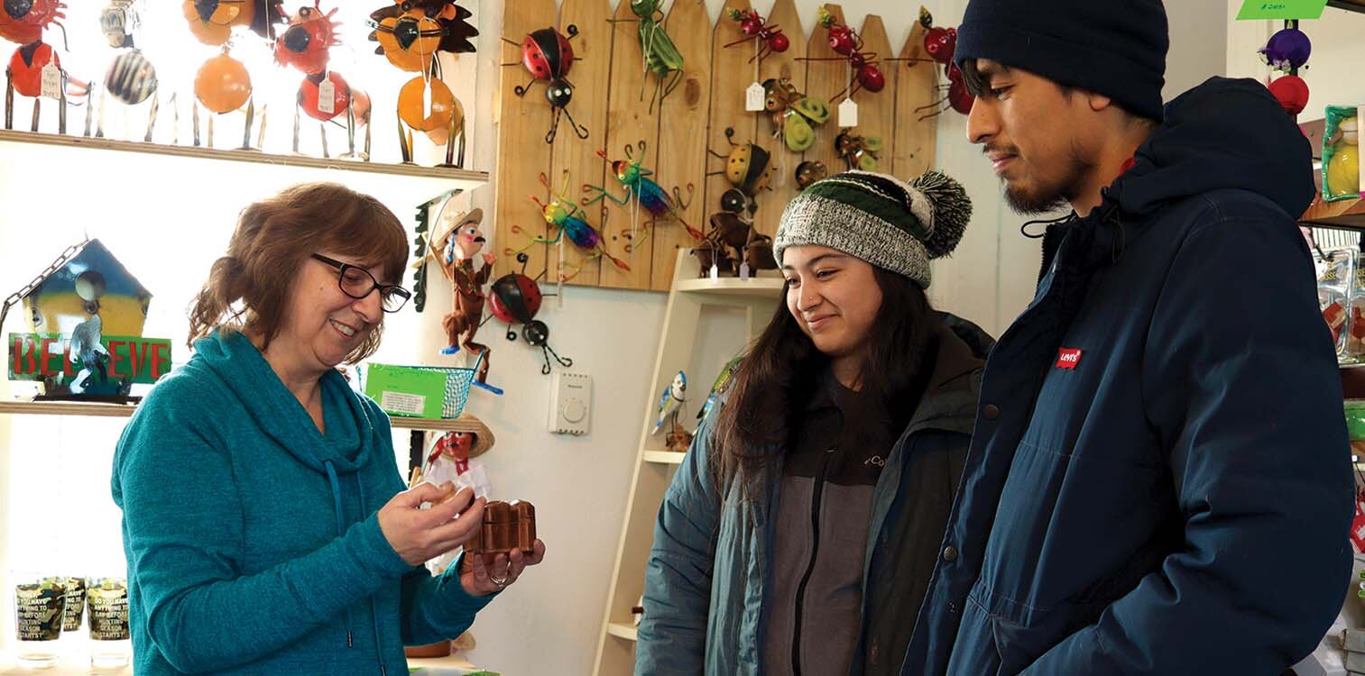 Georgina Jordan, left, who grew up near the Wells Street Corridor, opened a global gift shop, Cog & Pearl, there in July 2021.