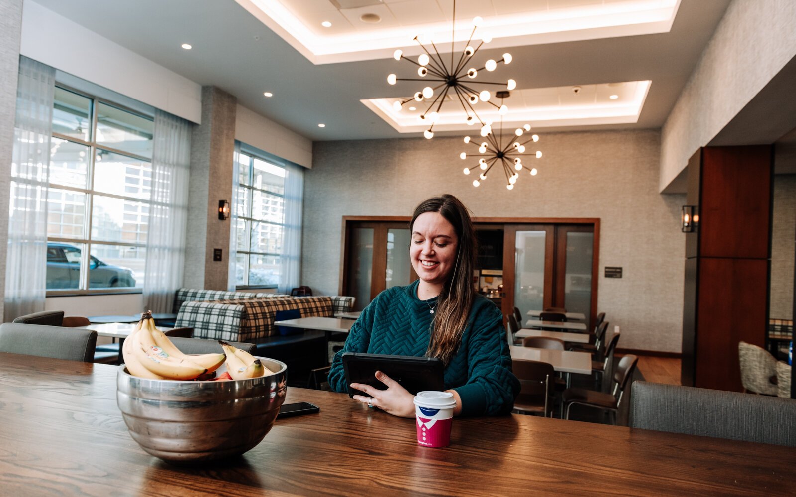 Laura Heiman utilizes the lobby while working remotely at Hampton Inn & Suites in Downtown.