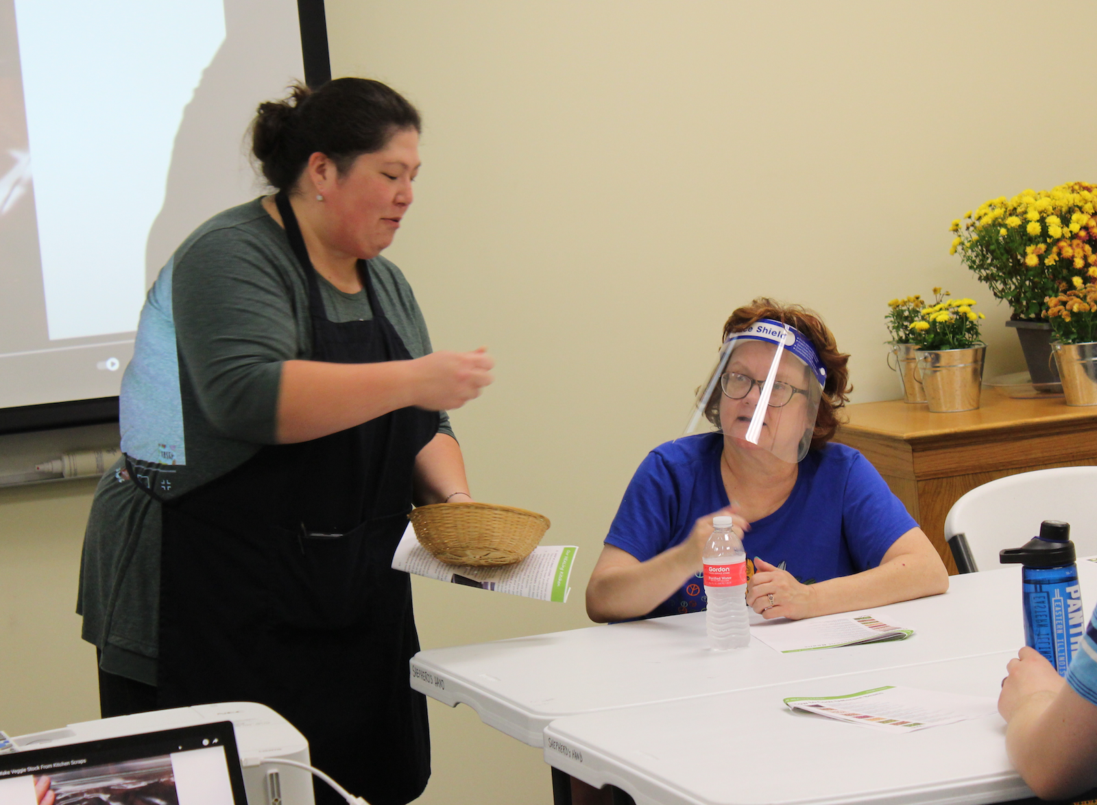 Kim Trombley announces the name of the winner of a healthy food item giveaway during the Our HEALing Kitchen class at Shepherd’s Hand.