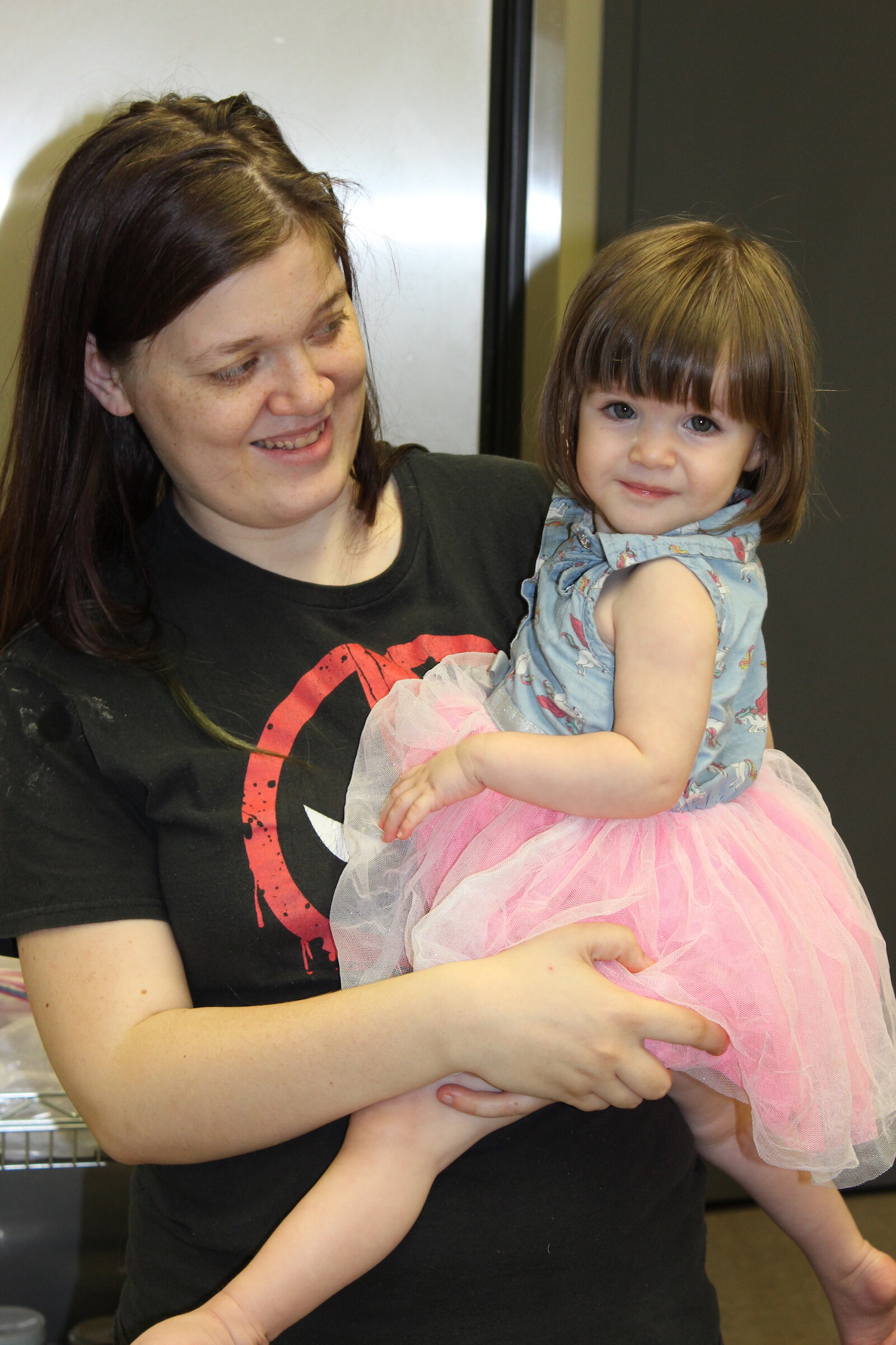 Ruth-Anne Rigby and her 18-month-old daughter waiting for class to start at The Shepherd’s Hand Community Outreach Center.