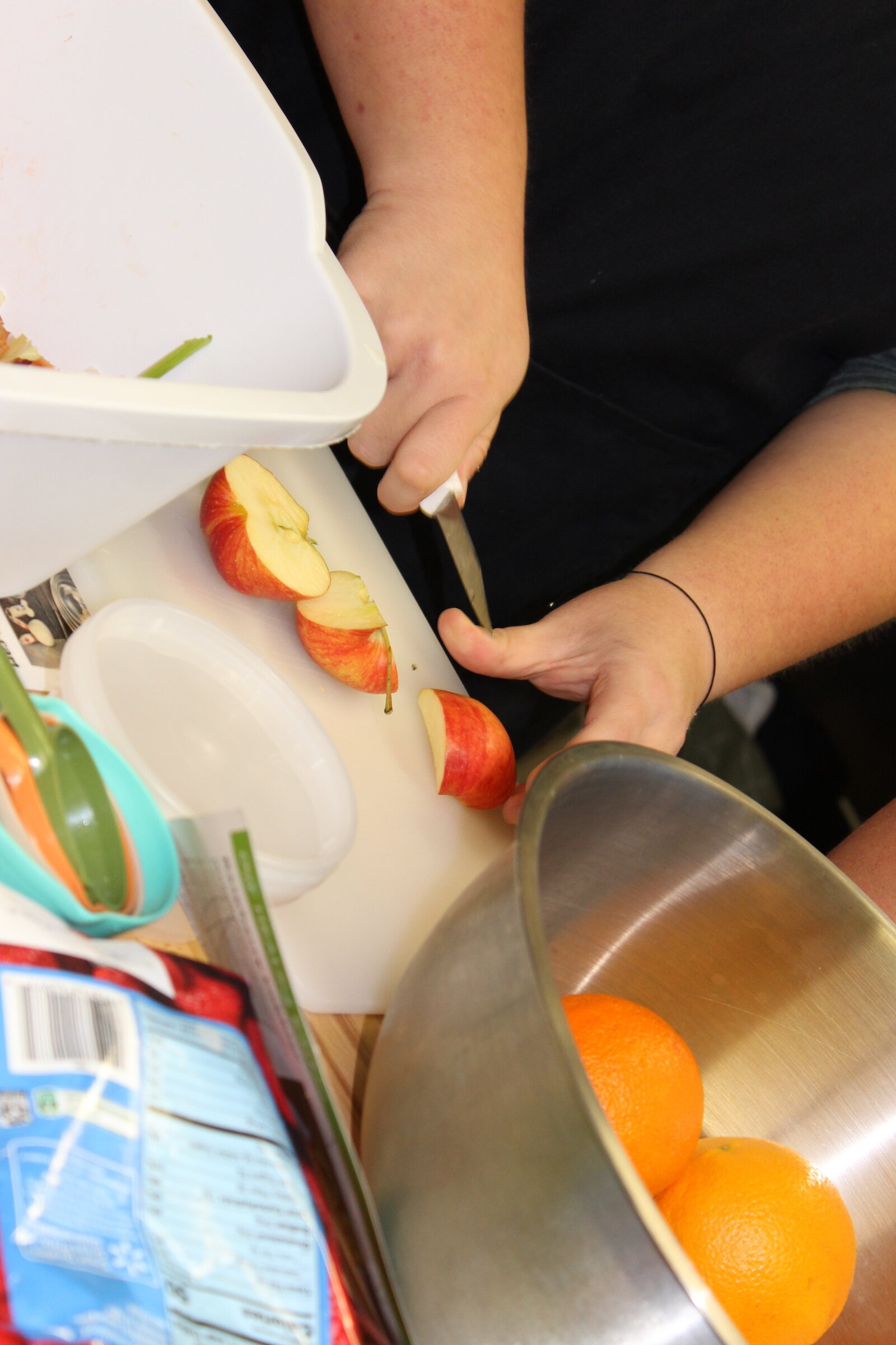 Participants cut carrots at the Our HEALing Kitchen class at Shepherd’s Hand.