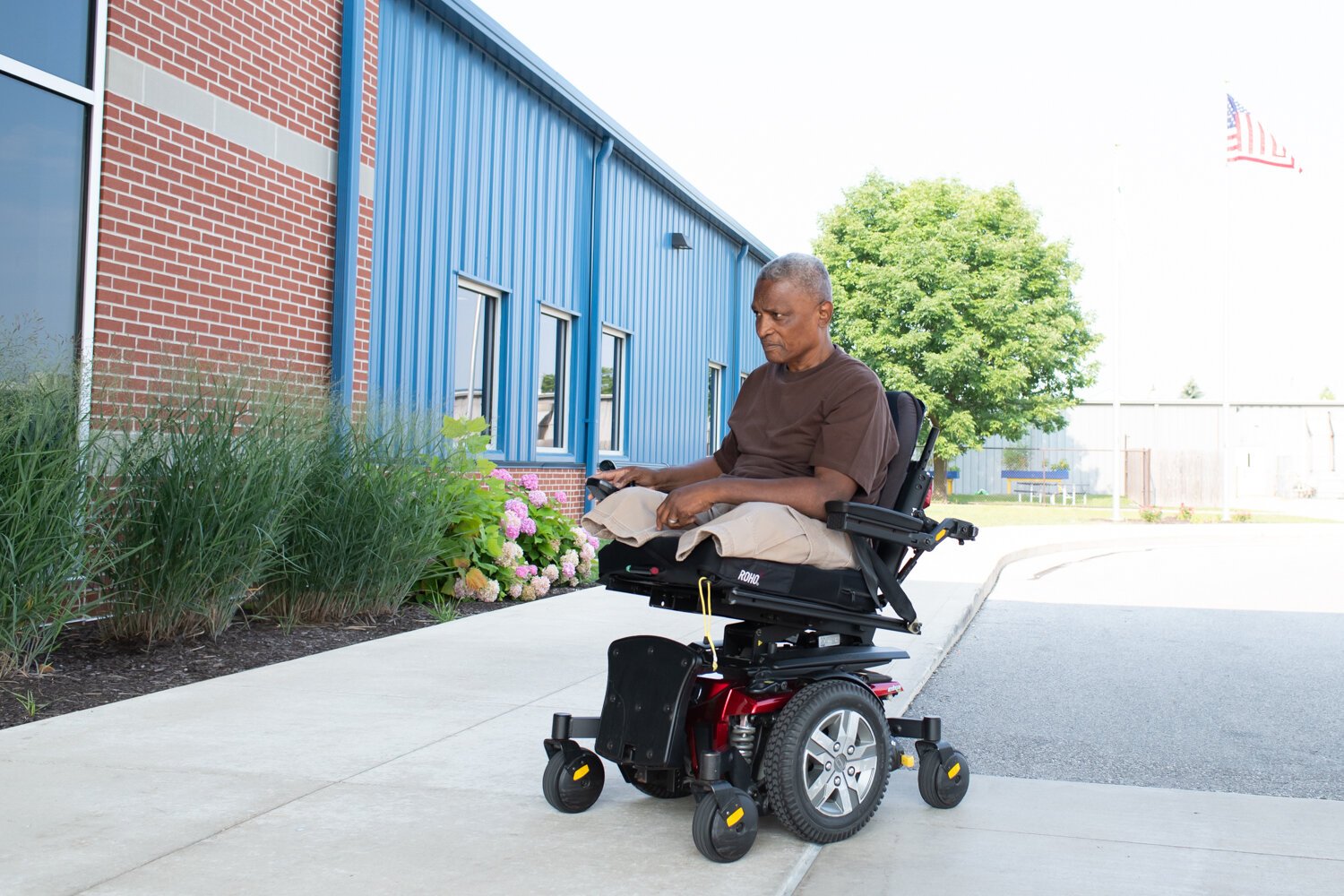 Alfred Woods uses the wheelchair ramp in front of Turnstone.