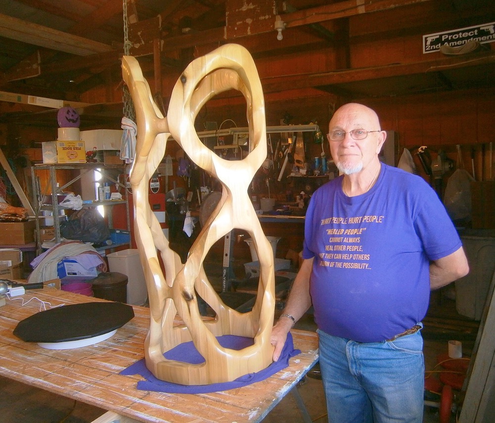 Rose stands next to his latest piece for the 2019 Decatur Scupture Tour, title “8-EIGHTY-8.”