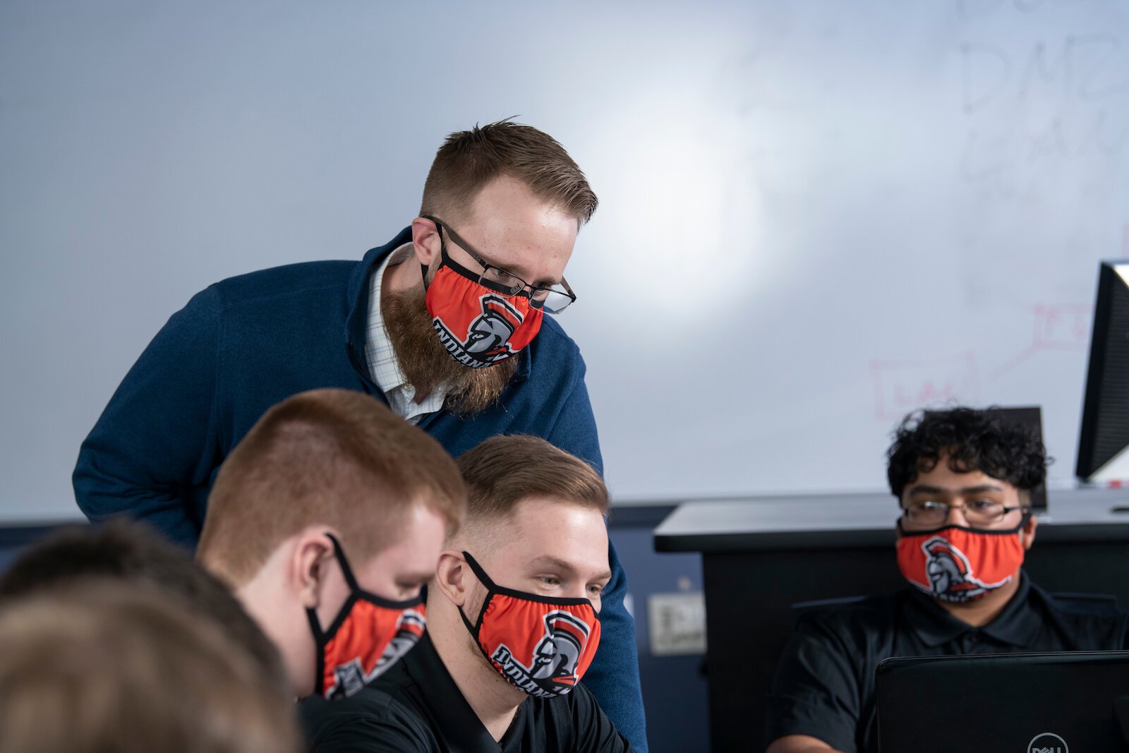 Matt Hansen, left, coaches the Indiana Tech Cyber Warriors.