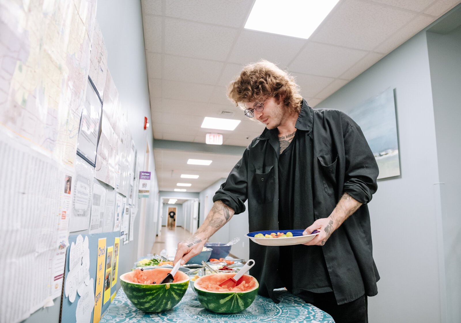 David Andrews dips a plate during "Super Saturday" a free monthly community meal for the housing members at River's Edge. River's Edge is a  supportive housing complex on Spy Run Ave. Ext. in Fort Wayne.