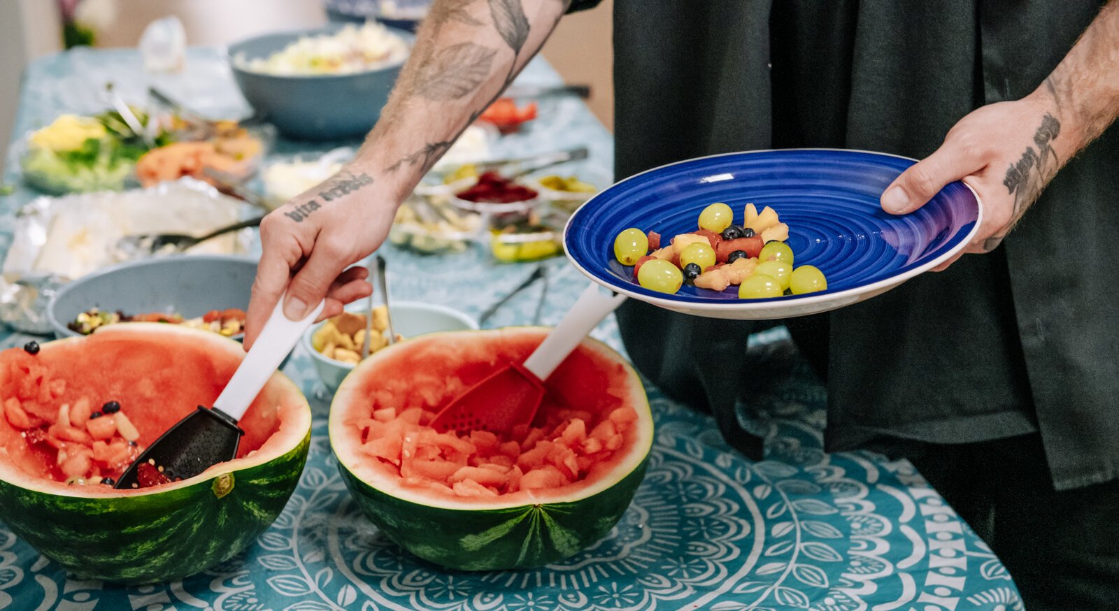 Kent Carter dips a plate during "Super Saturday" a free monthly community meal for the housing members at River's Edge. River's Edge is a  supportive housing complex on Spy Run Ave. Ext. in Fort Wayne.