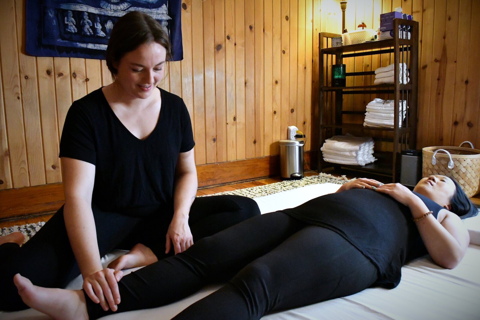 Julia Hyndman practices Thai massage with a client.