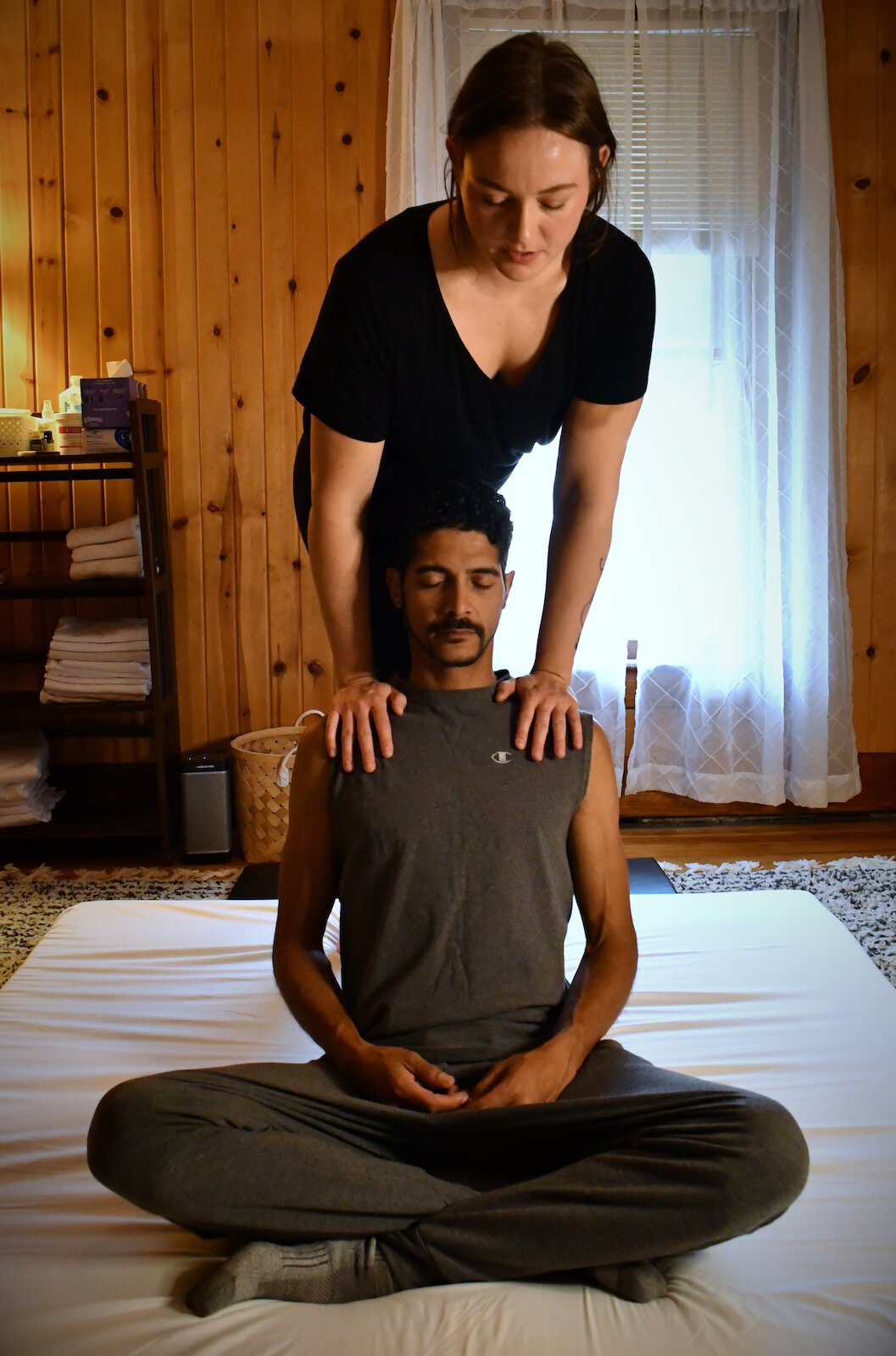 Julia Hyndman, Owner of Tulip Tree Healing, practices Thai massage with a client.