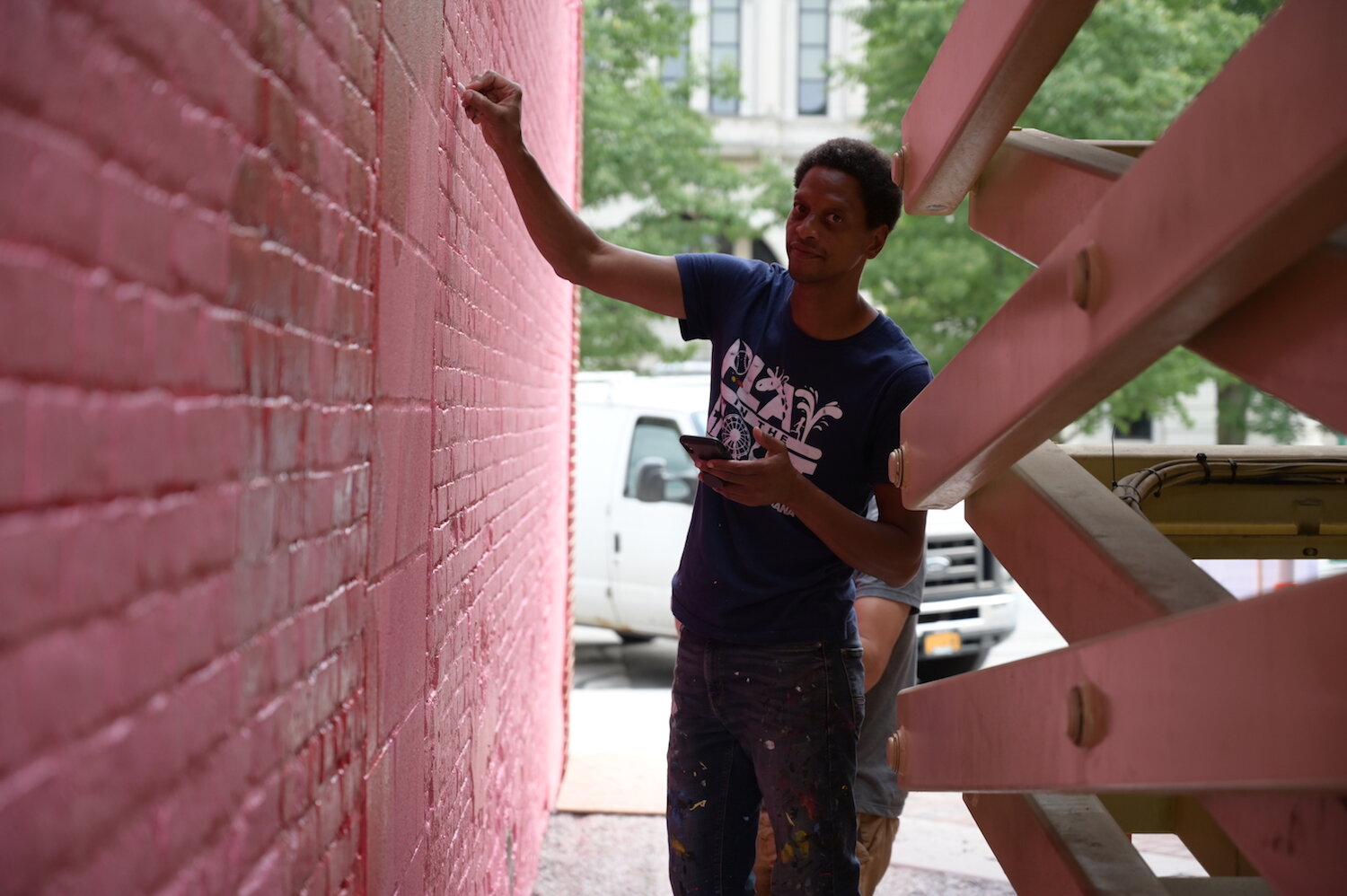 Shawn Dunwoody works on a mural in downtown Columbia City.