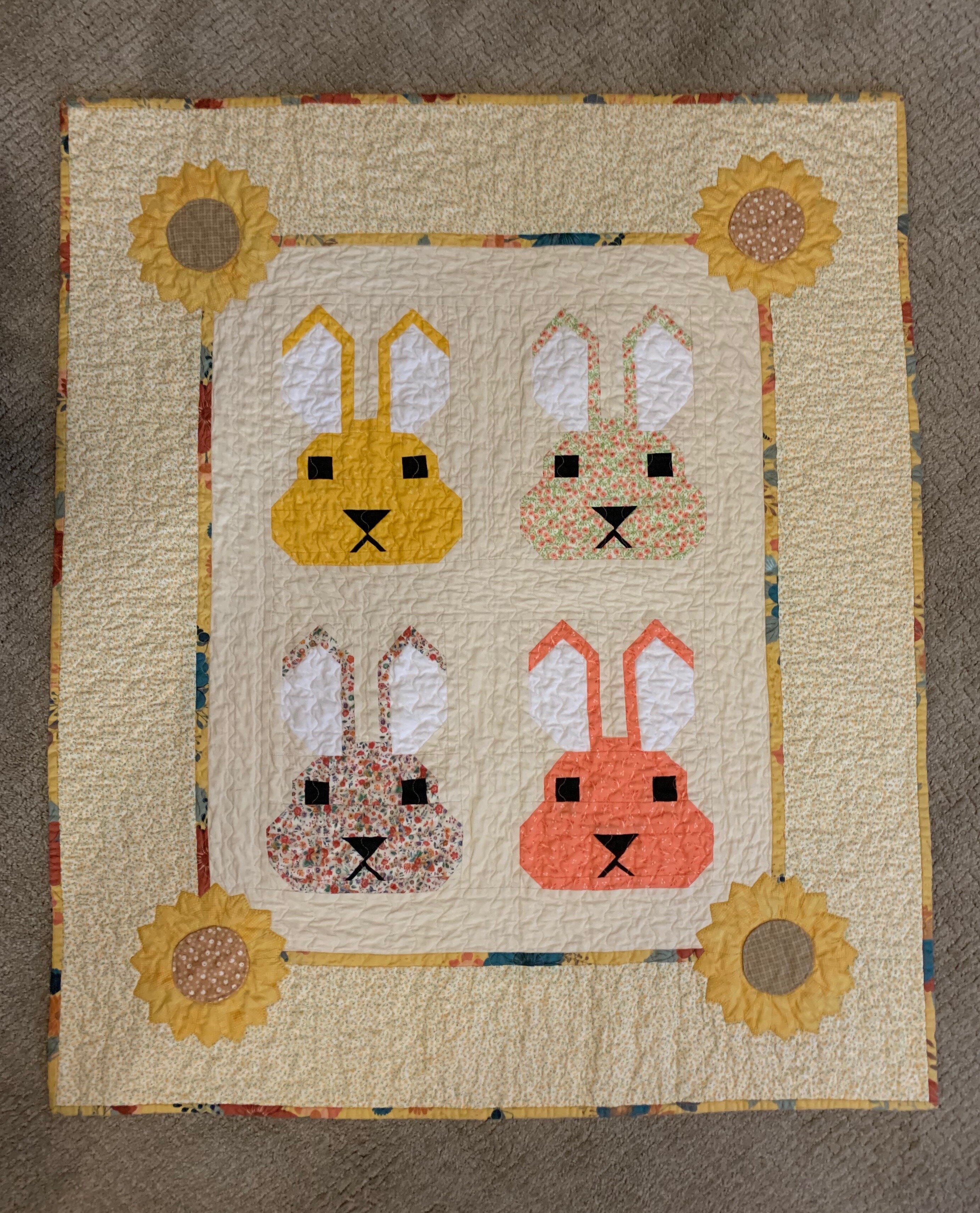 A baby quilt made by Christine Paul.
