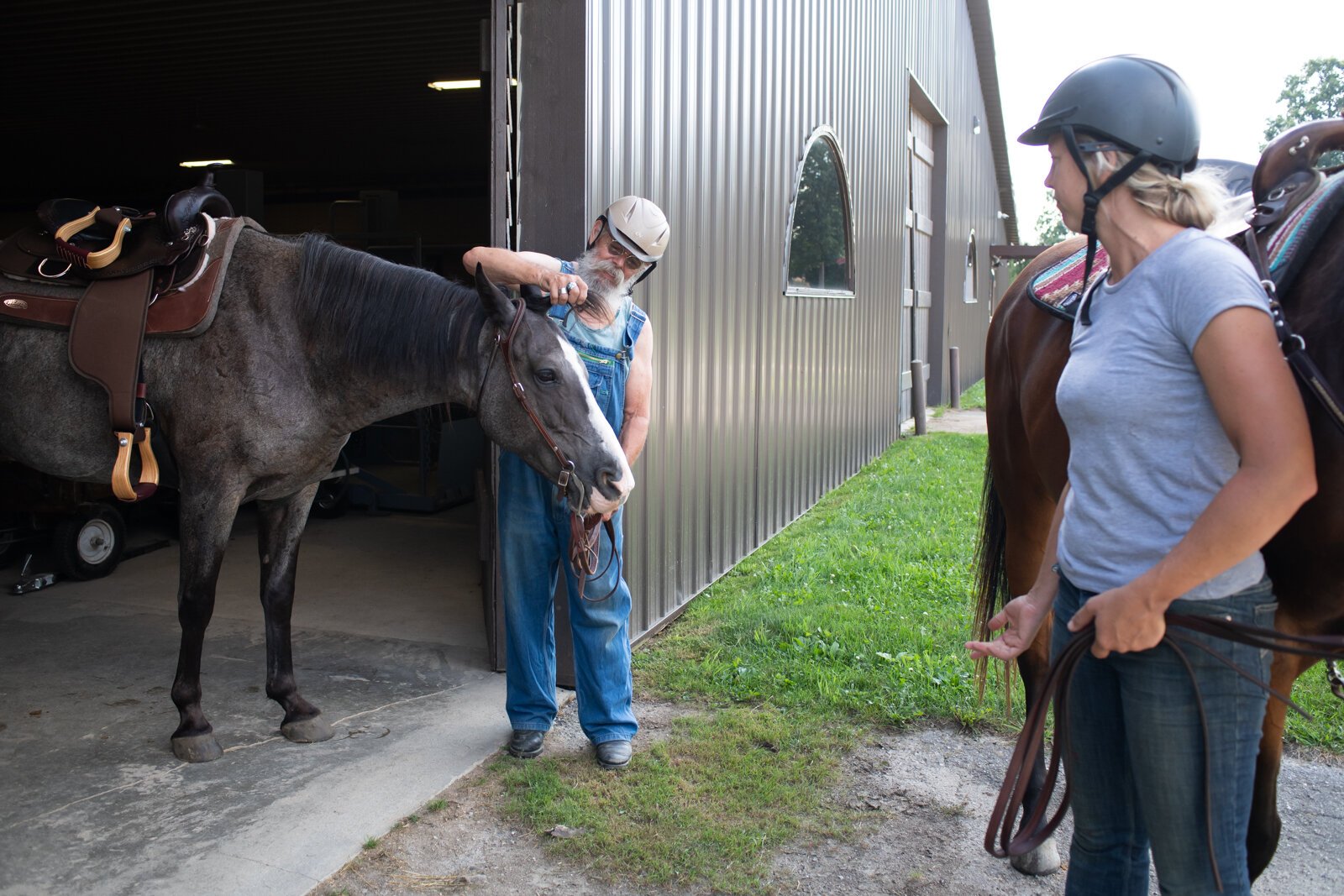Allison Wheaton rides horse Belle and veteran Randal Clemens rides horse Mojo at Summit Equestrian Center, 10808 La Cabreah Ln.