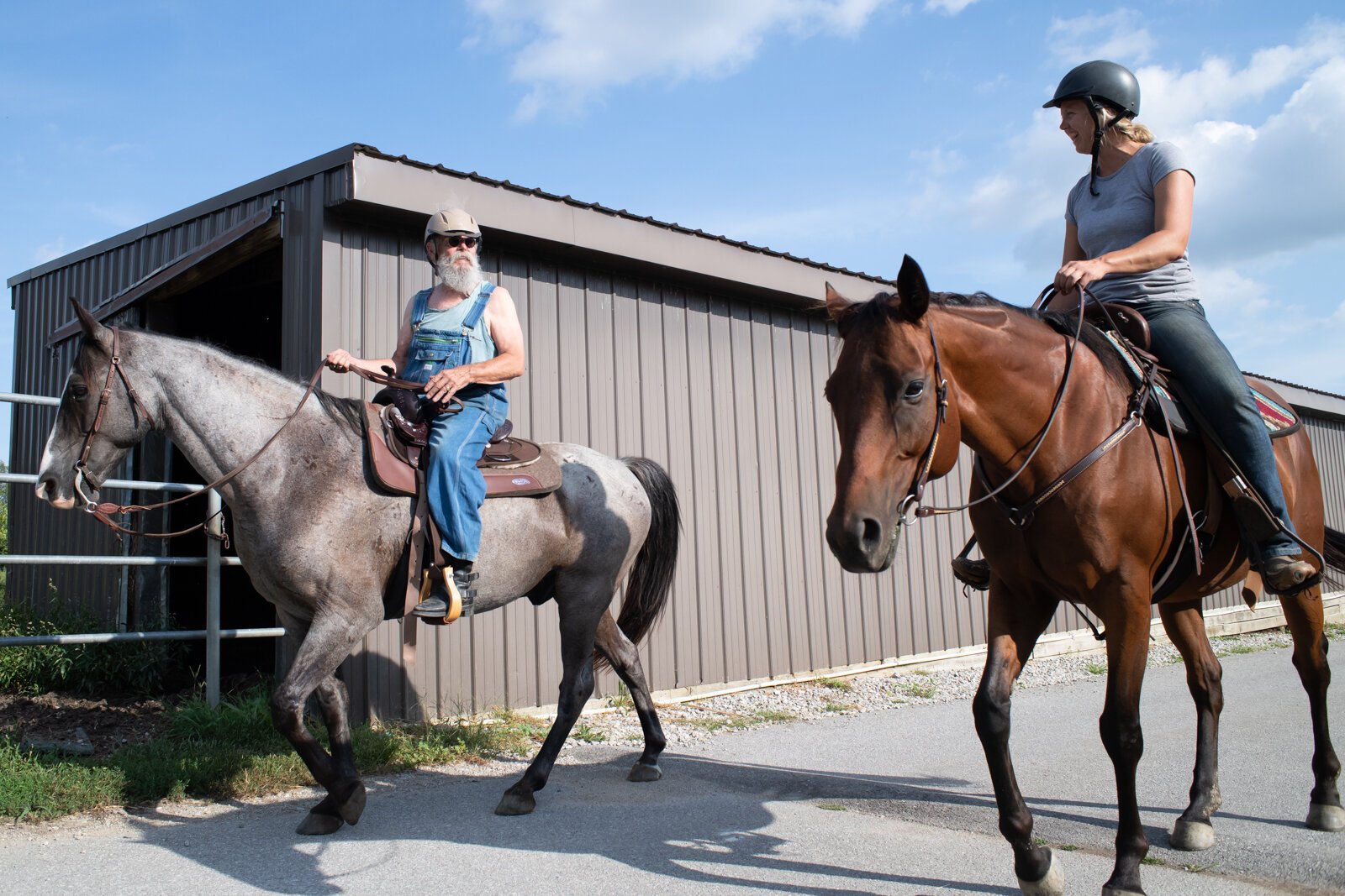 Allison Wheaton rides horse Belle and veteran Randal Clemens rides horse Mojo at Summit Equestrian Center, 10808 La Cabreah Ln.