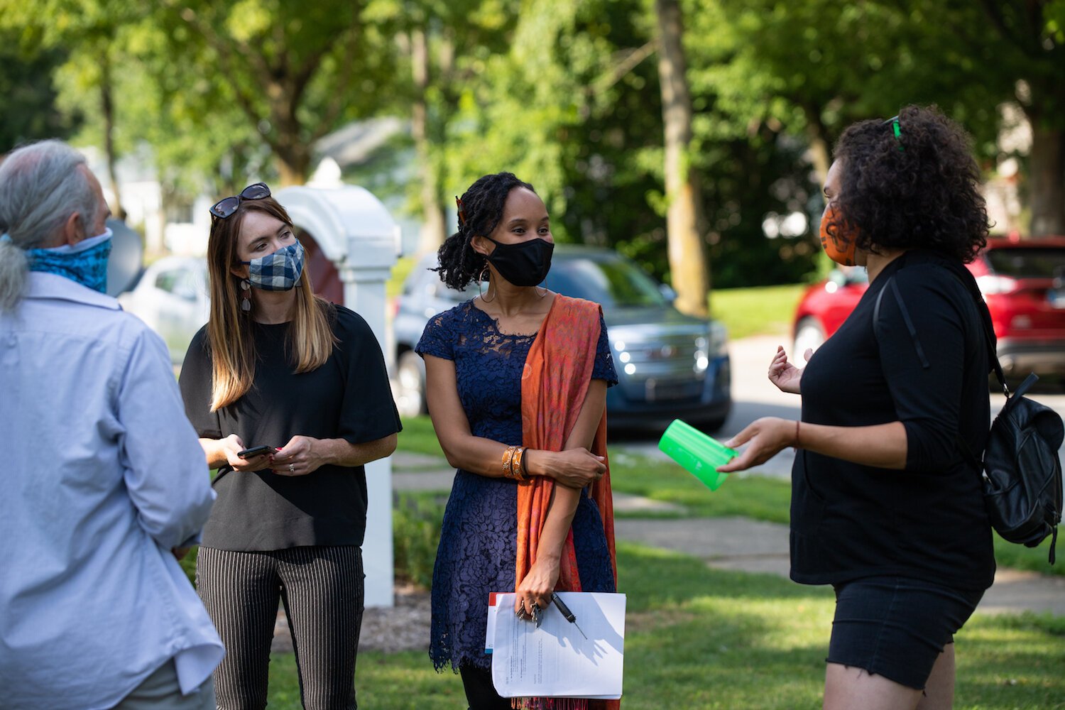 Kara Hackett of Input Fort Wayne, left, and Réna Bradley of Bridge of Grace, center, talk with guests.