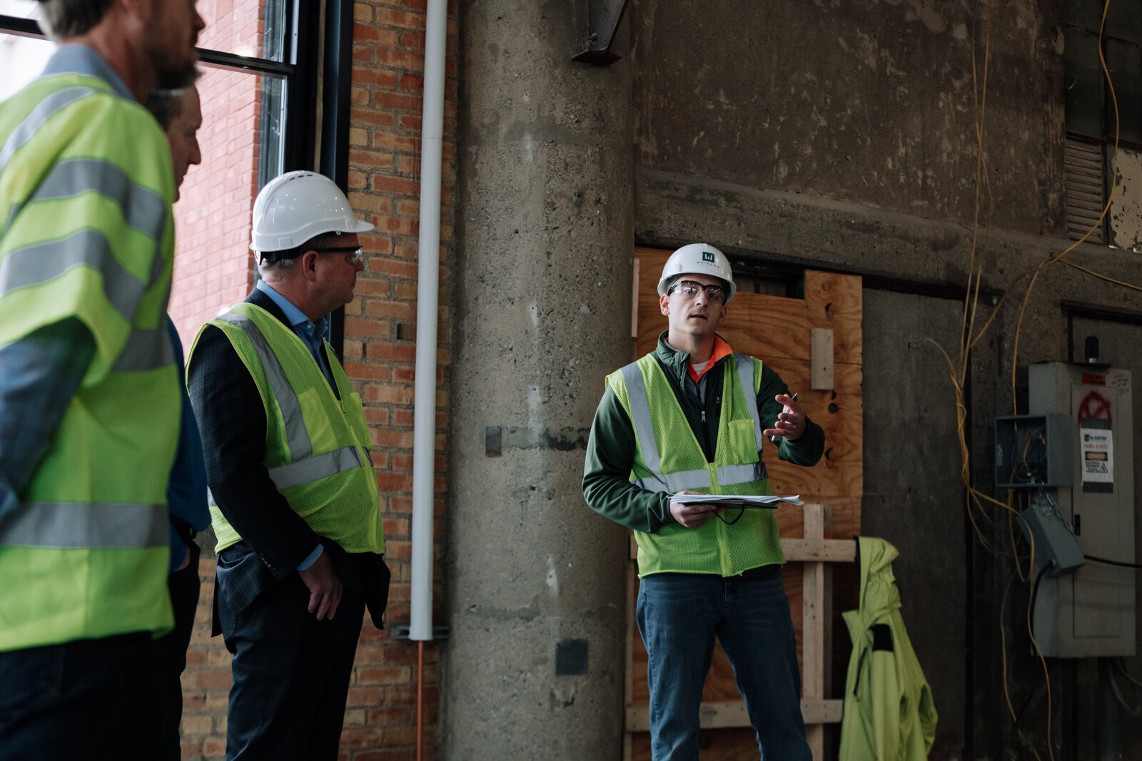 Cody Michaud, Senior Project Manager with Weigand Construction, speaks during a media tour of the Do it Best space on December 3, 2021.