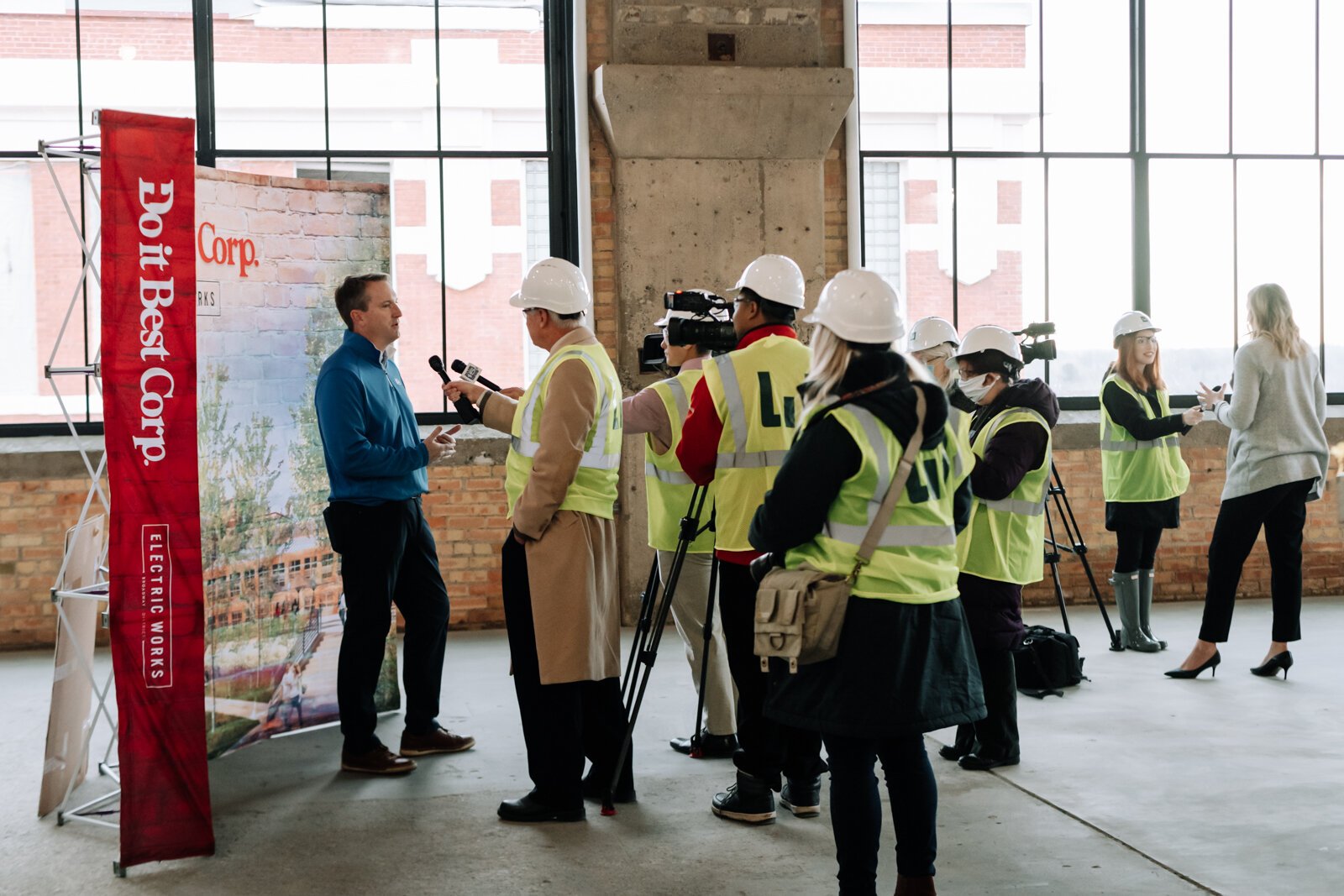 Members of the media question Dan Starr, President and CEO of Do it Best, left, during a media tour of the Do it Best space at Electric Works on December 3, 2021. 
