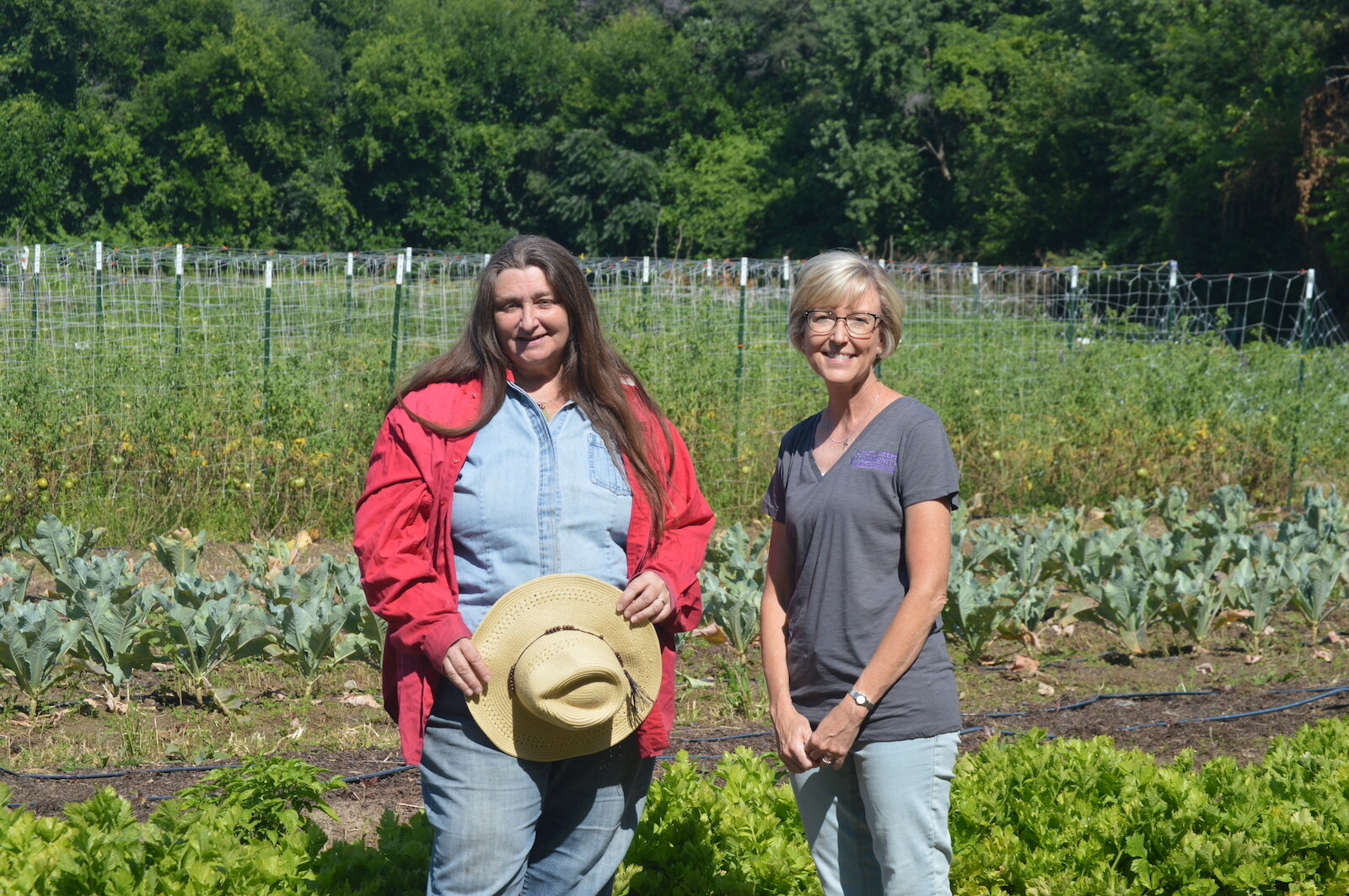 Mary Tyndall, right, is Double Up Program Manager & Chief Storyteller at the St. Joe Community Health Foundation. She poses with a Rose Avenue Education Farmer.