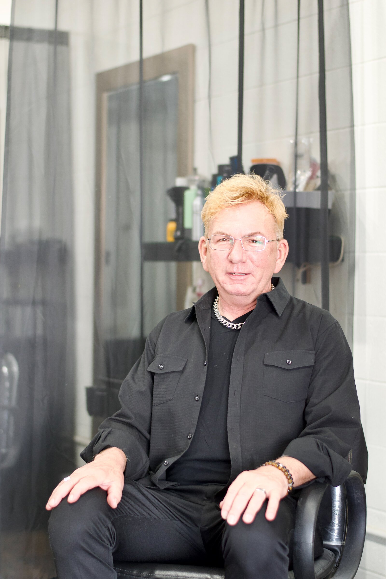 Portrait of Michael Schram, owner of Michael Michael's Salon and Spa.