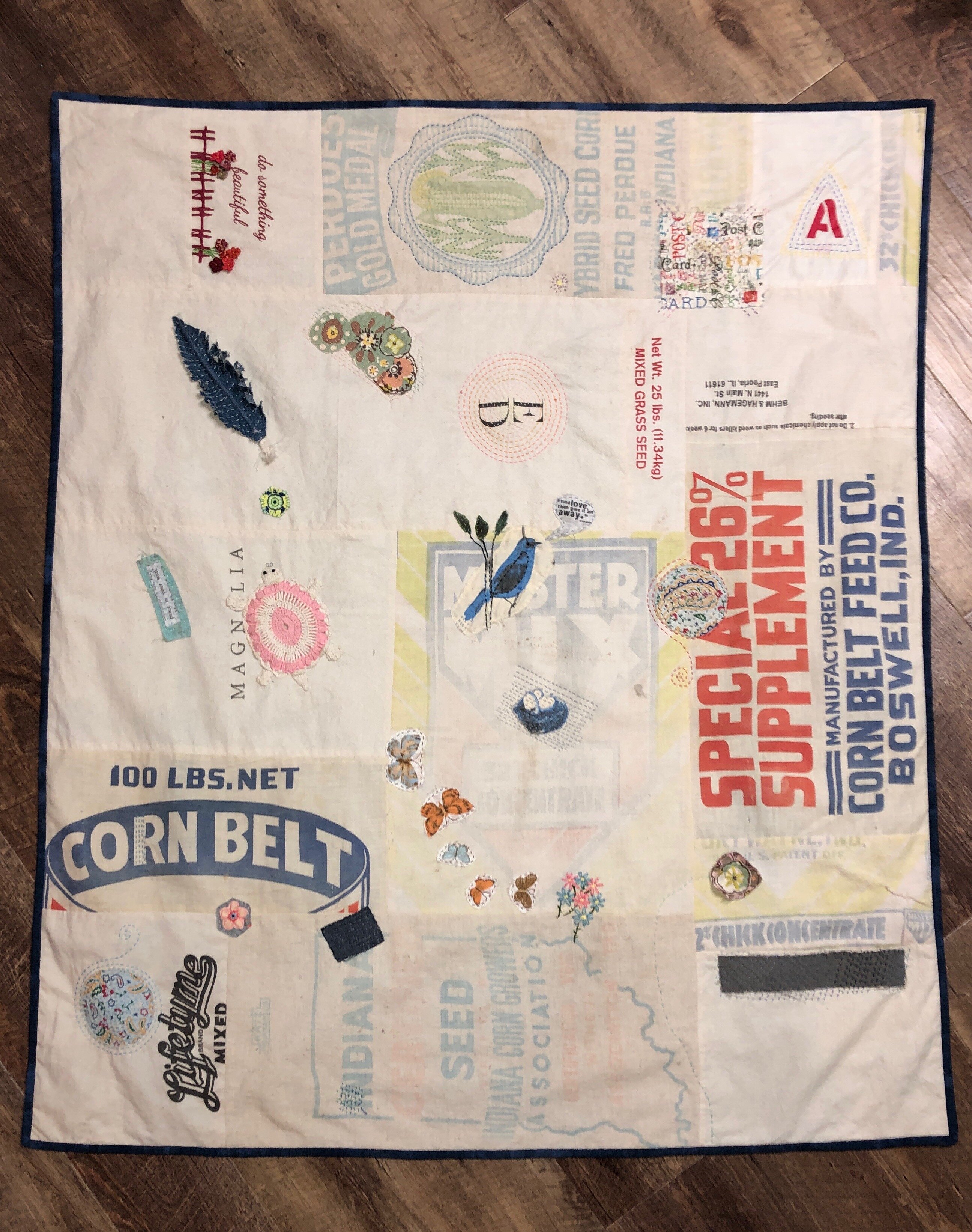 A quilt made from feed sacks made by Christine Paul.