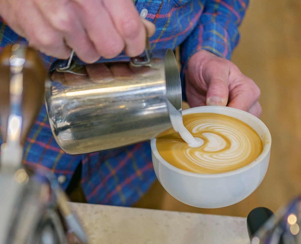 At latte art throwdowns, baristas pour latte designs in front of a live audience.