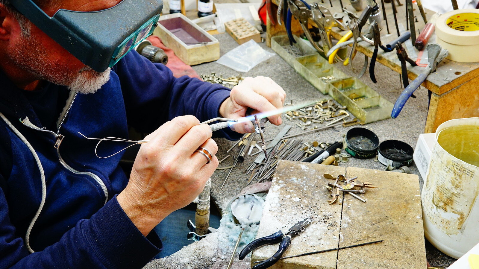 An employee mounts the keys on an oboe at Fox Products, a musical instrument manufacturer.