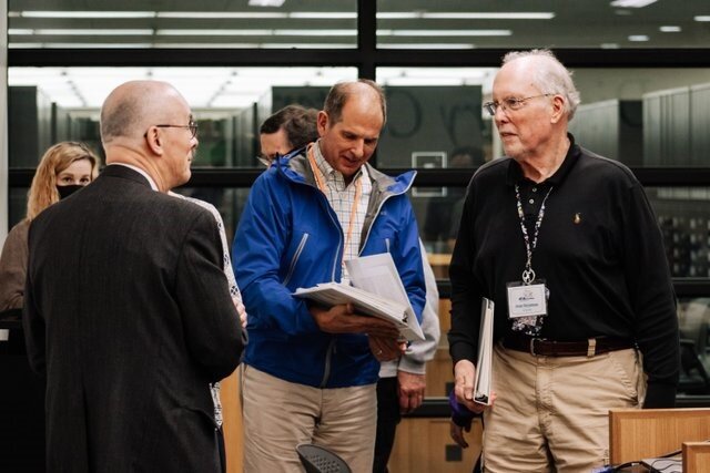 Genealogy Center Manager, Curt Witcher, left, works with patrons at the Genealogy Center.