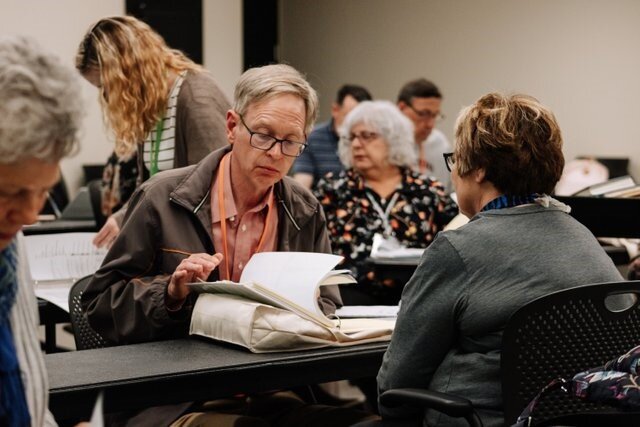 Library patrons conduct family research at the Genealogy Center.