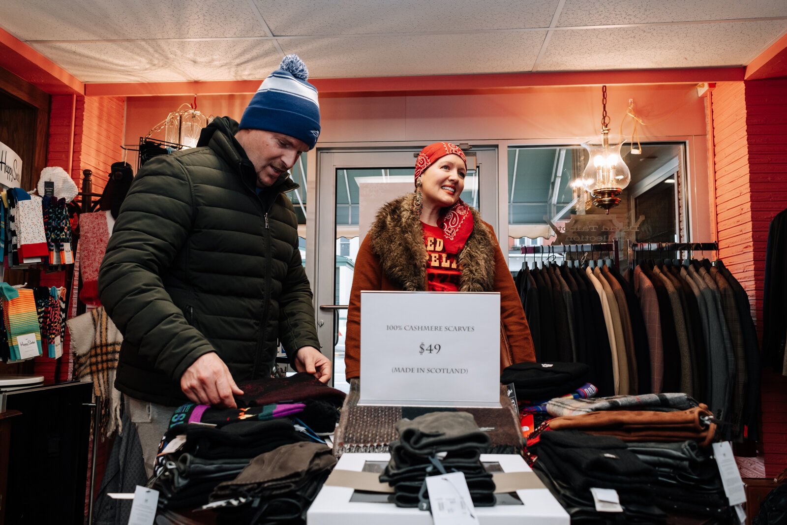 Vienne and Tony Didier look at the cashmere scarves while shopping at David Talbott Collection.