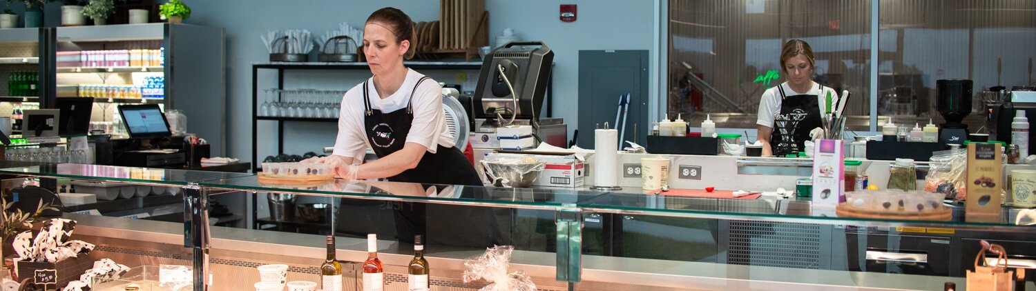 Kim Chaney works on putting out samples for customers at the Golfo Di Napoli Dairy.