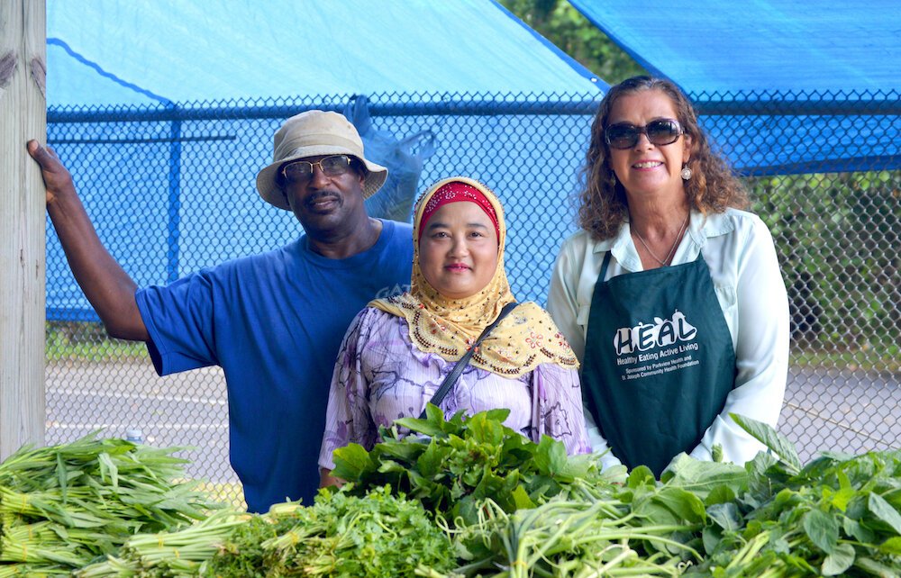 Gonzalee Martin, left, and Laura Dwire, right, partner with local growers like Mar De Nar, center.