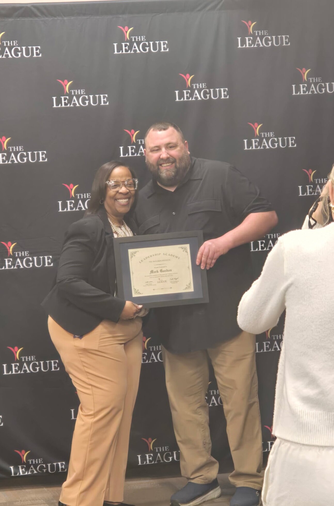 Mark Gordon poses at The League’s Leadership Academy graduation with Mayor Sharon Tucker.