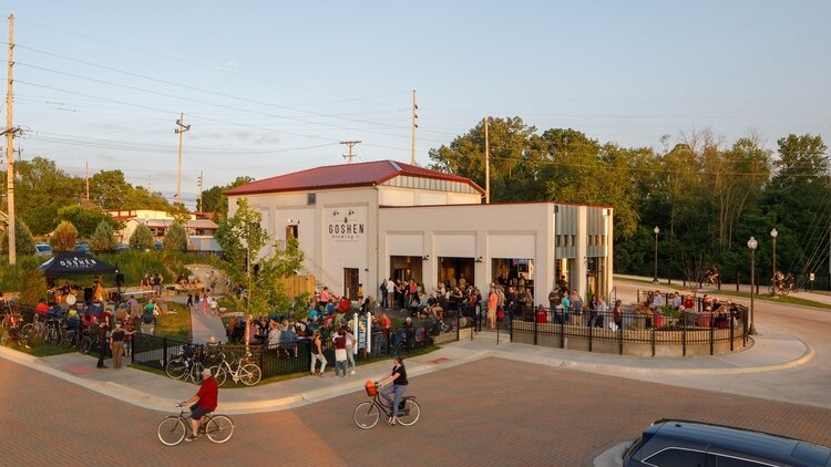 Bikers and others converge on Goshen Brewing Company on a warm day in Goshen.