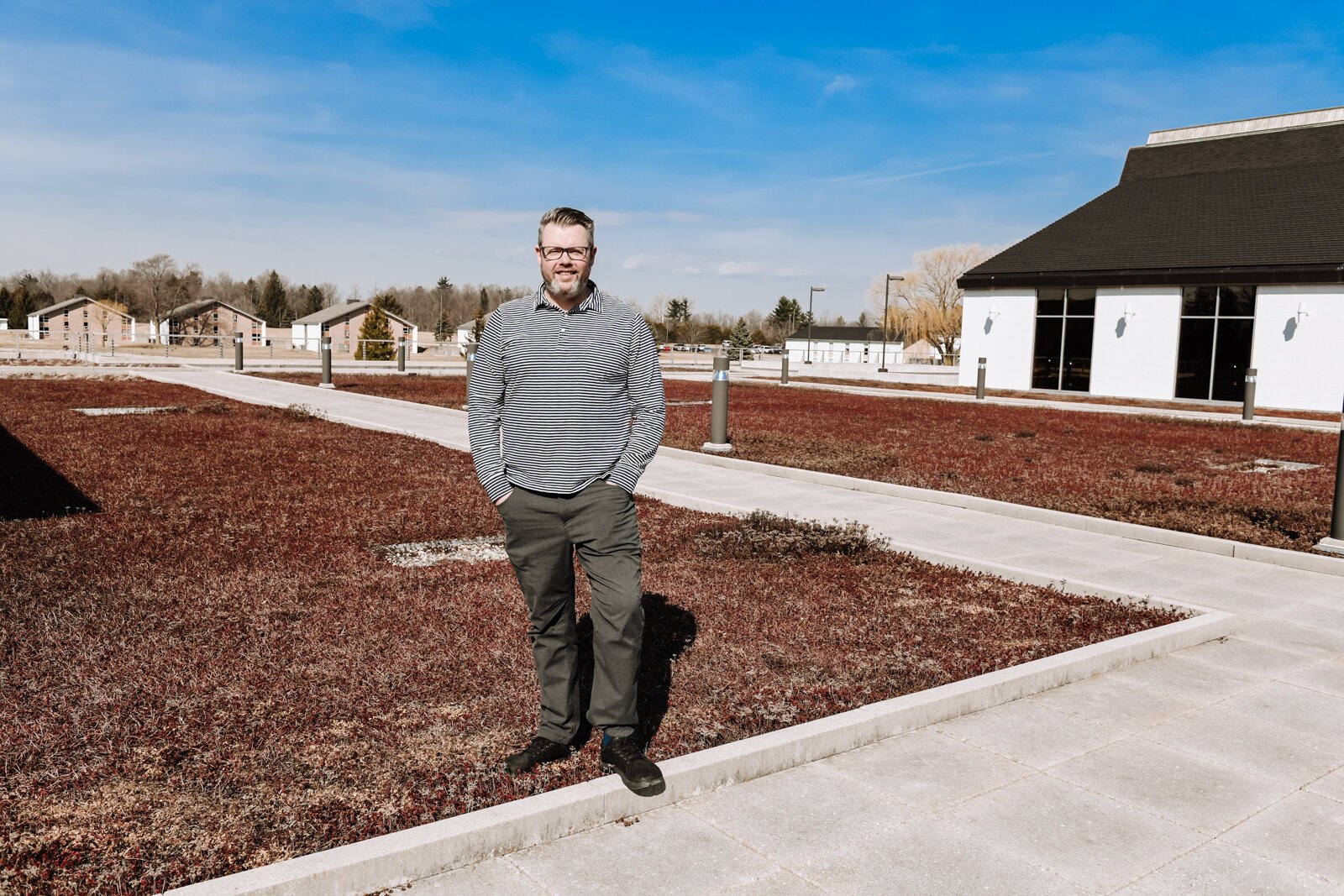 Deputy Director of Planning and Development at Fort Wayne Parks and Recreation Alec Johnson stands atop the green "living" roof at Concordia Theological Seminary (CTSFW) at 6600 N. Clinton St.