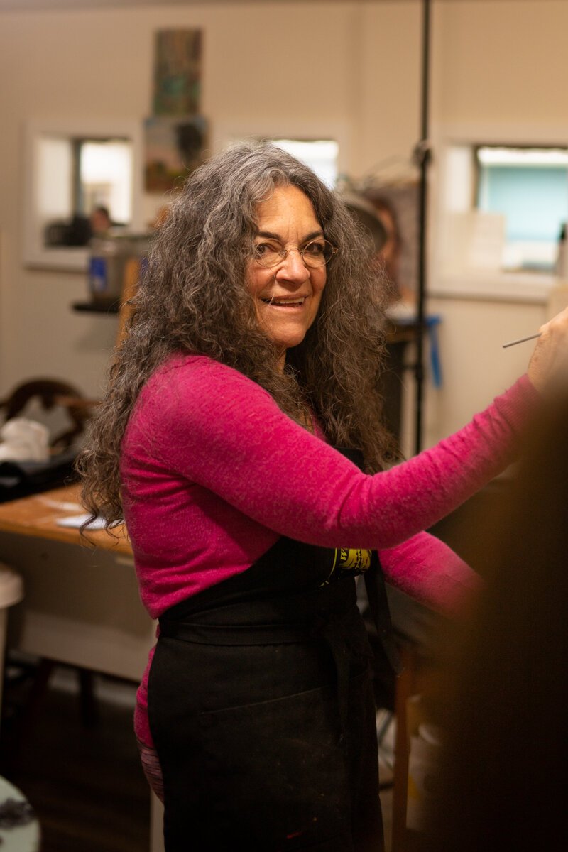 Hilarie Couture, a former street artist, paints in her home studio in Williams Woodland Park of Fort Wayne.