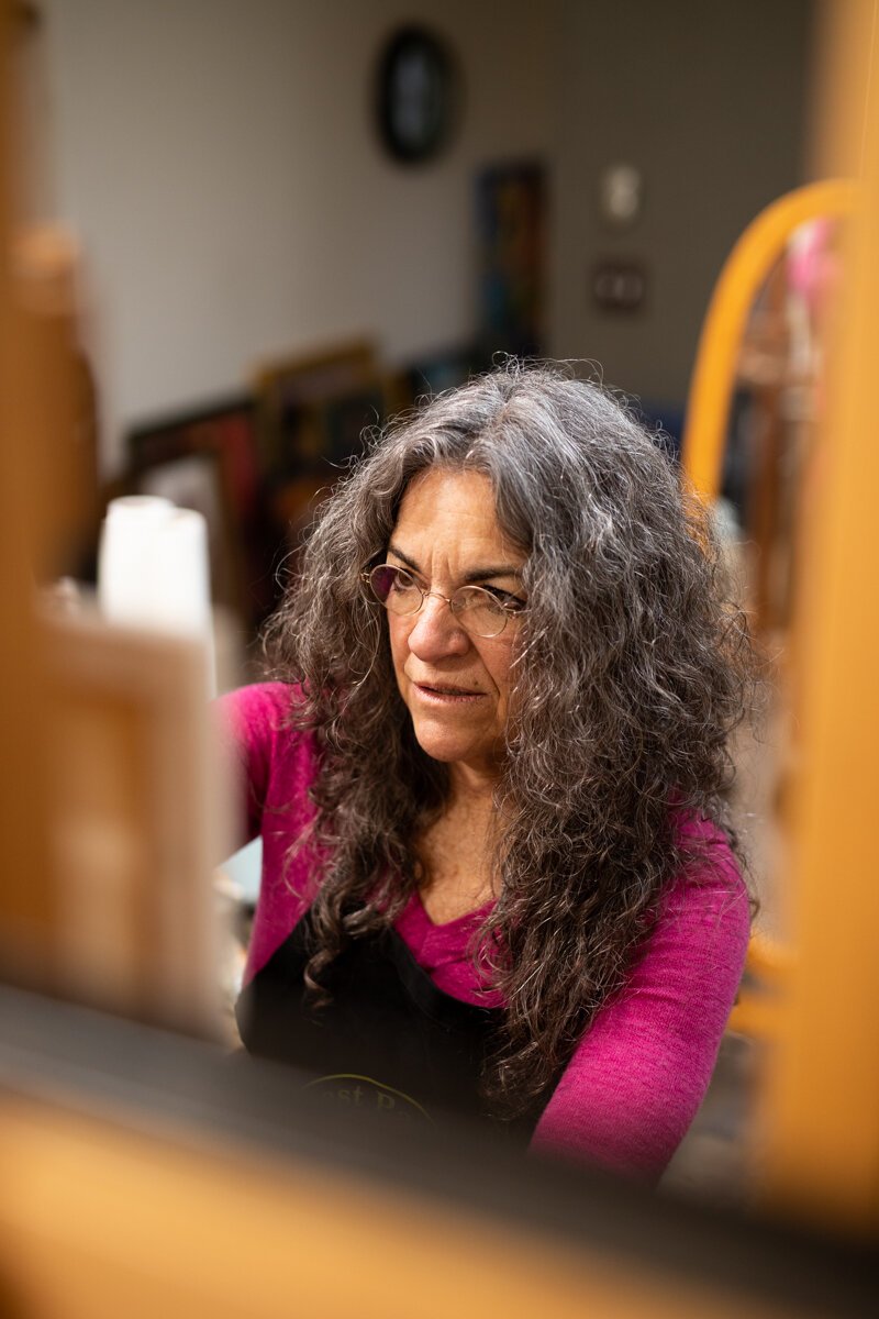 Hilarie Couture, a former street artist, paints in her home studio in Williams Woodland Park of Fort Wayne.