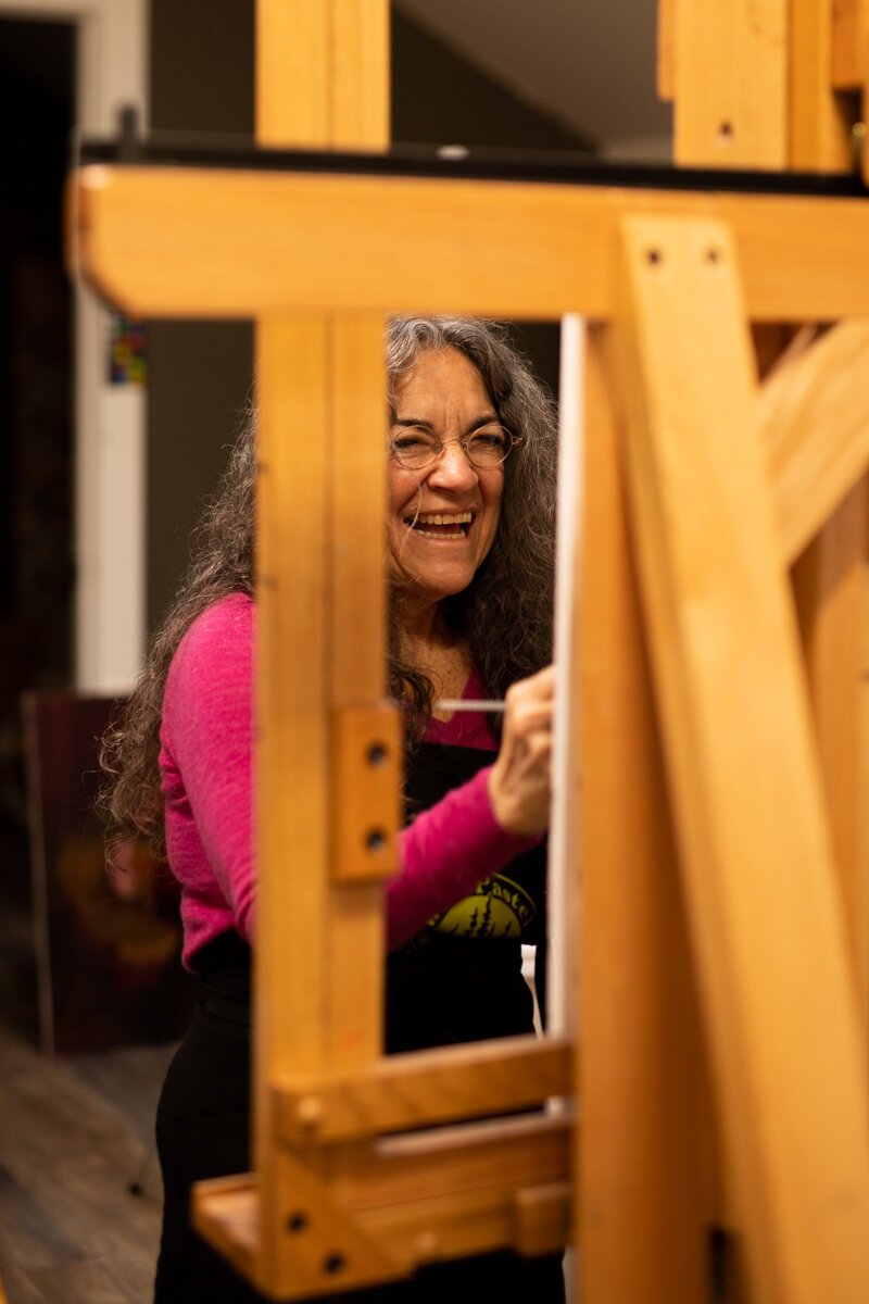 Hilarie Couture, a former street artist, paints in her home studio in Williams Woodland Park of Fort Wayne.