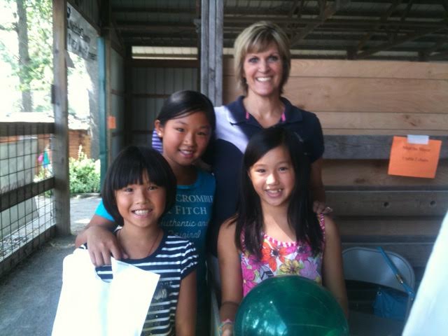 Mayor SuzAnne Handshoe, right, with students from one of her Junior Achievement classes.