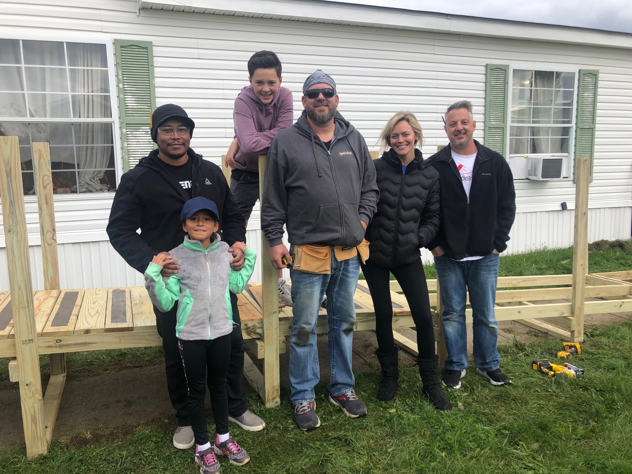 NeighborLink volunteers collaborate on service projects in Fort Wayne neighborhoods, like building ramps.